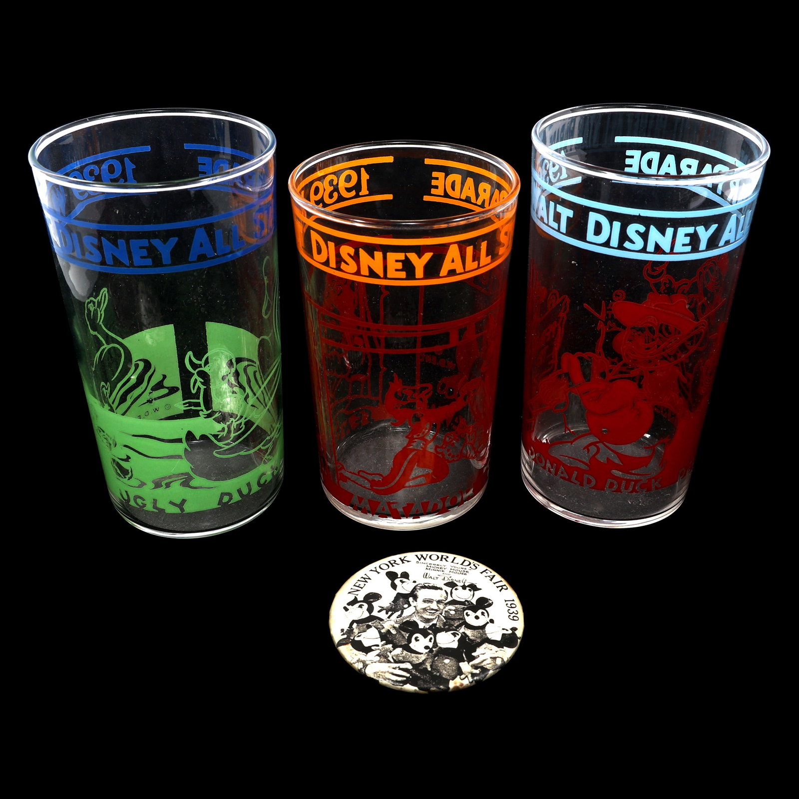 NEW YORK WORLD'S FAIR 1939 DISNEY BUTTON & GLASSES: NEW YORK WORLD'S FAIR 1939 DISNEY BUTTON & GLASSES 1939 New York World's Fair Disney souvenirs: Glass tumblers: Ferdinand, Matador & Senorita (2.5" x 4.25")