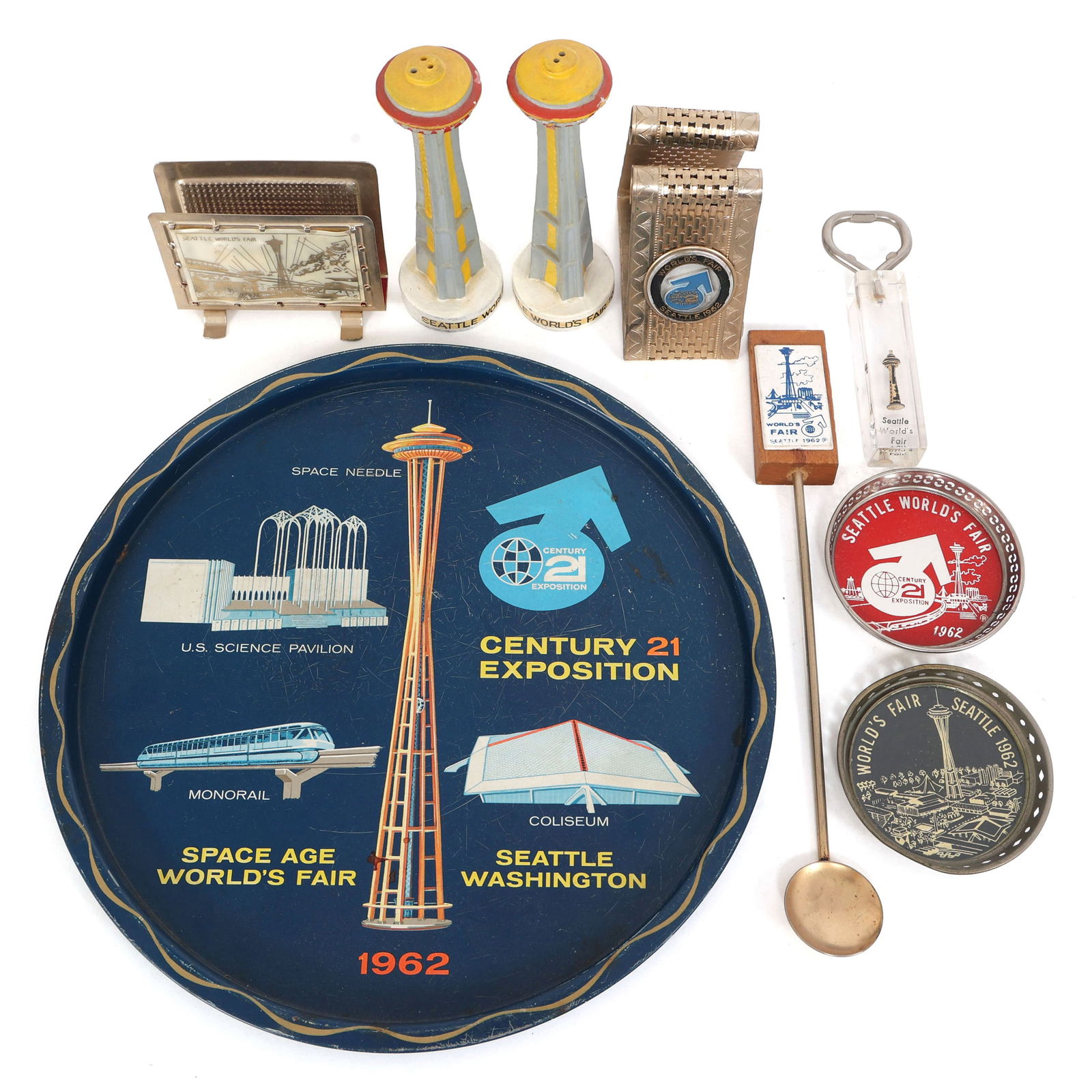 SEATTLE WORLD'S FAIR 1962 TABLE ACCESSORIES: SEATTLE WORLD'S FAIR 1962 TABLE ACCESSORIES Seattle World's Fair 1962 Table Accessories. Includes Space Needle salt & pepper shakers, napkin holders, bottle opener, (2) drink coasters, souvenir spoon,