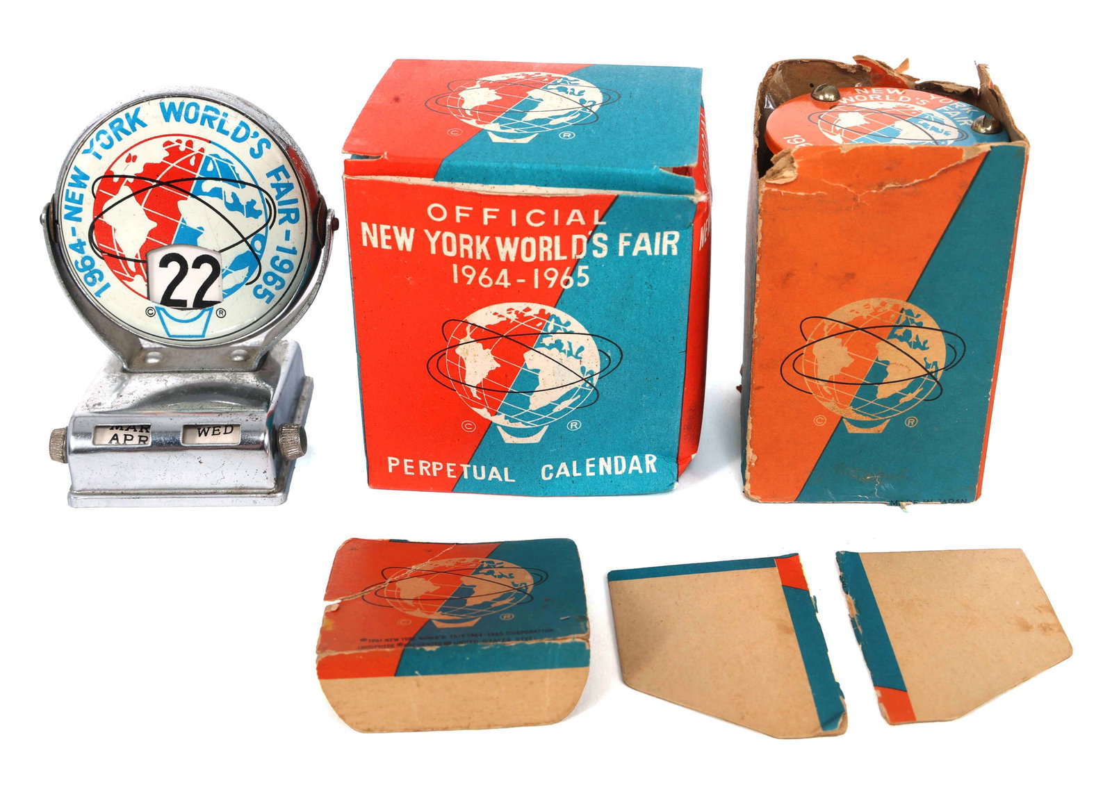 NEW YORK WORLD'S FAIR 1964 PERPETUAL CALENDERS & TIMER: NEW YORK WORLD'S FAIR 1964 PERPETUAL CALENDERS & TIMER 1964-65 New York World's Fair perpetual calendars & 3-minute timer: (2) Perpetual calendars, (1) in original box (2" x 2.5 x 3") 3-Minute hou