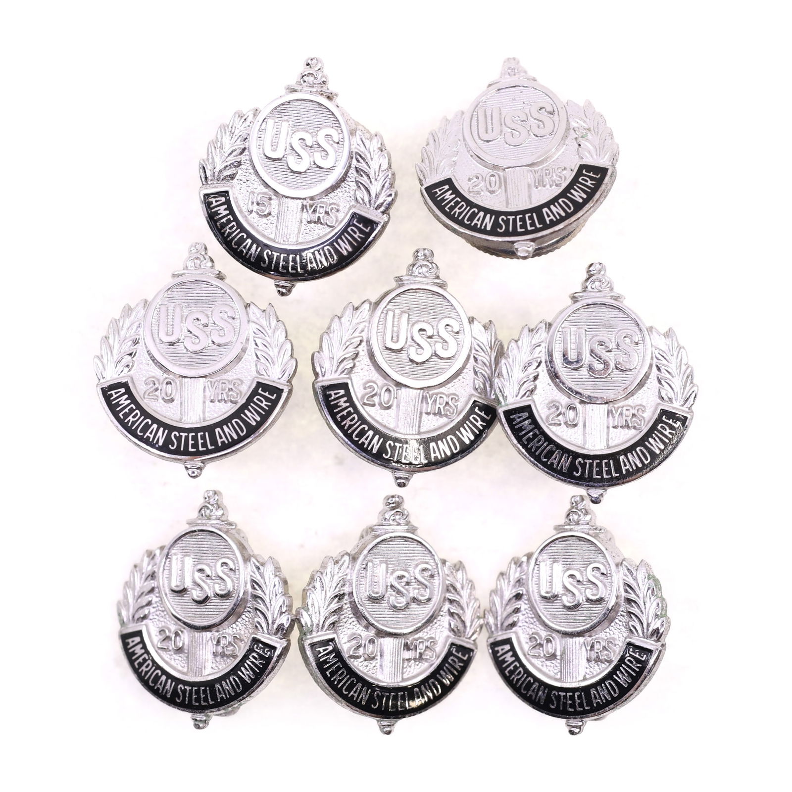 STERLING SILVER US STEEL CORP 15 & 20-YEAR PINS: STERLING SILVER US STEEL CORP 15 & 20-YEAR PINS Sterling silver United States Steel Corp service pins: (1) 15-year (7) 20-year Size: 0.5" Weight: 25 g