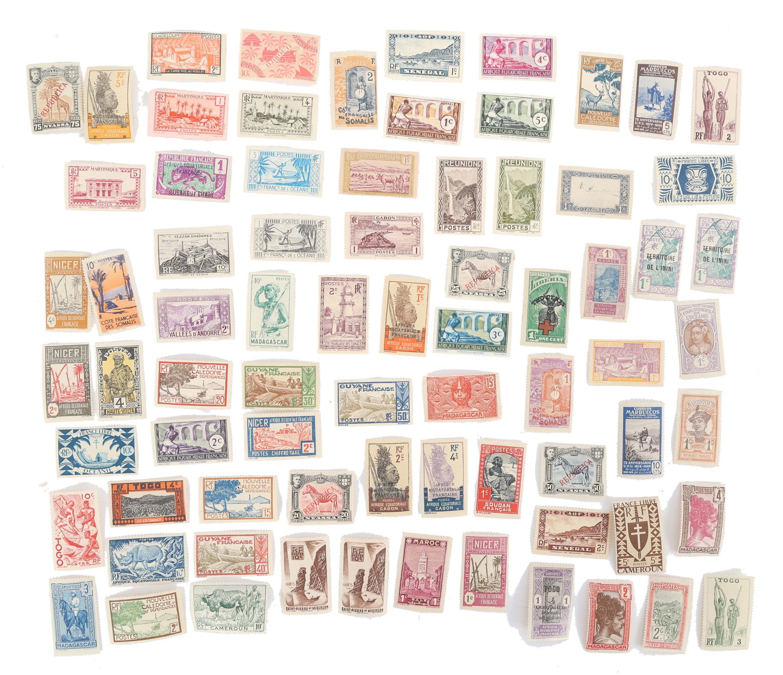 AFRICAN POSTAGE STAMPS: AFRICAN POSTAGE STAMPS Over 60 International Loose Postage Stamps. Countries include French Guyana, Madagascar, Togo, Niger, and more. None are used or cancelled.