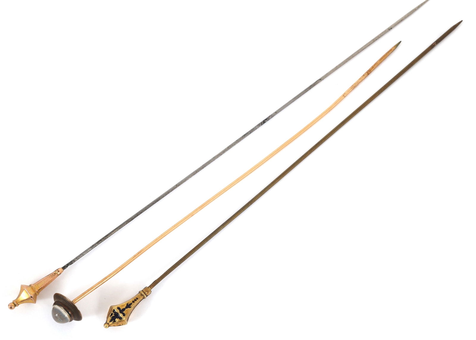 VICTORIAN HATPINS WITH 10K & 14K GOLD HEADS: VICTORIAN HATPINS WITH 10K & 14K GOLD HEADS Victorian hatpins made of base metal, with 10K and 14K yellow gold heads. One is accented with moonstone. Size: 6" to 7" Weight: 6g