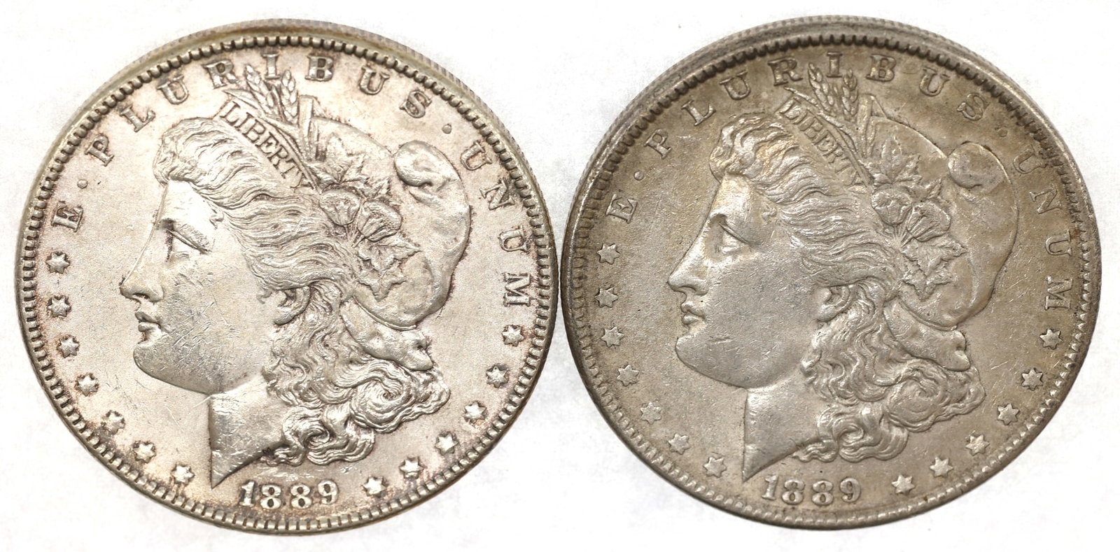 1889 US SILVER MORGAN $1 VF/XF COINS - LOT OF 2: 1889 US SILVER MORGAN $1 VF/XF COINS - LOT OF 2 Two 1889 United States .900 silver Morgan Dollar coins, VF to XF condition. IMPORTANT NOTE - PLEASE READ: OUR IN-HOUSE SHIPPING & INVOICING Shippi