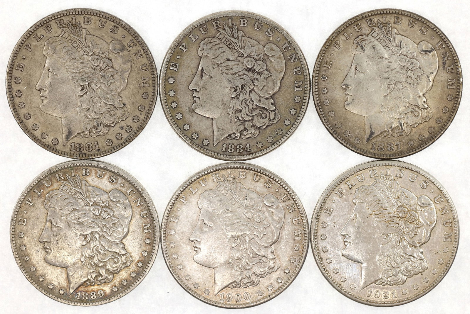 US SILVER MORGAN DOLLAR XF COINS - LOT OF 6: US SILVER MORGAN DOLLAR XF COINS - LOT OF 6 United States .900 silver Morgan $1 coins. Dates include: 1881-P 1884-P 1887-P 1889-O 1900-P 1921-S </