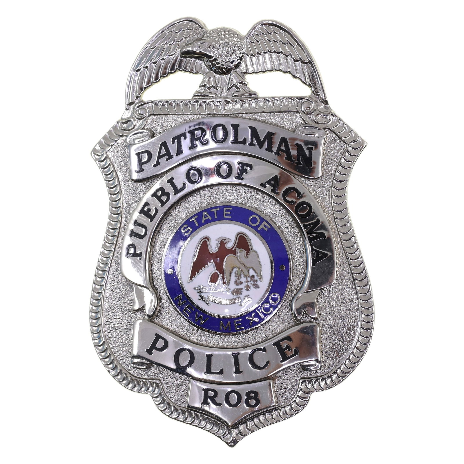 OBSOLETE PUEBLO OF ACOMA NM POLICE PATROLMAN BADGE #R08: OBSOLETE PUEBLO OF ACOMA NM POLICE PATROLMAN BADGE #R08 Obsolete Pueblo of Acoma, New Mexico Police Patrolman Badge, numbered R08. Maker marked by Blackinton on the reverse. Measurements: 1.75" - 2.75