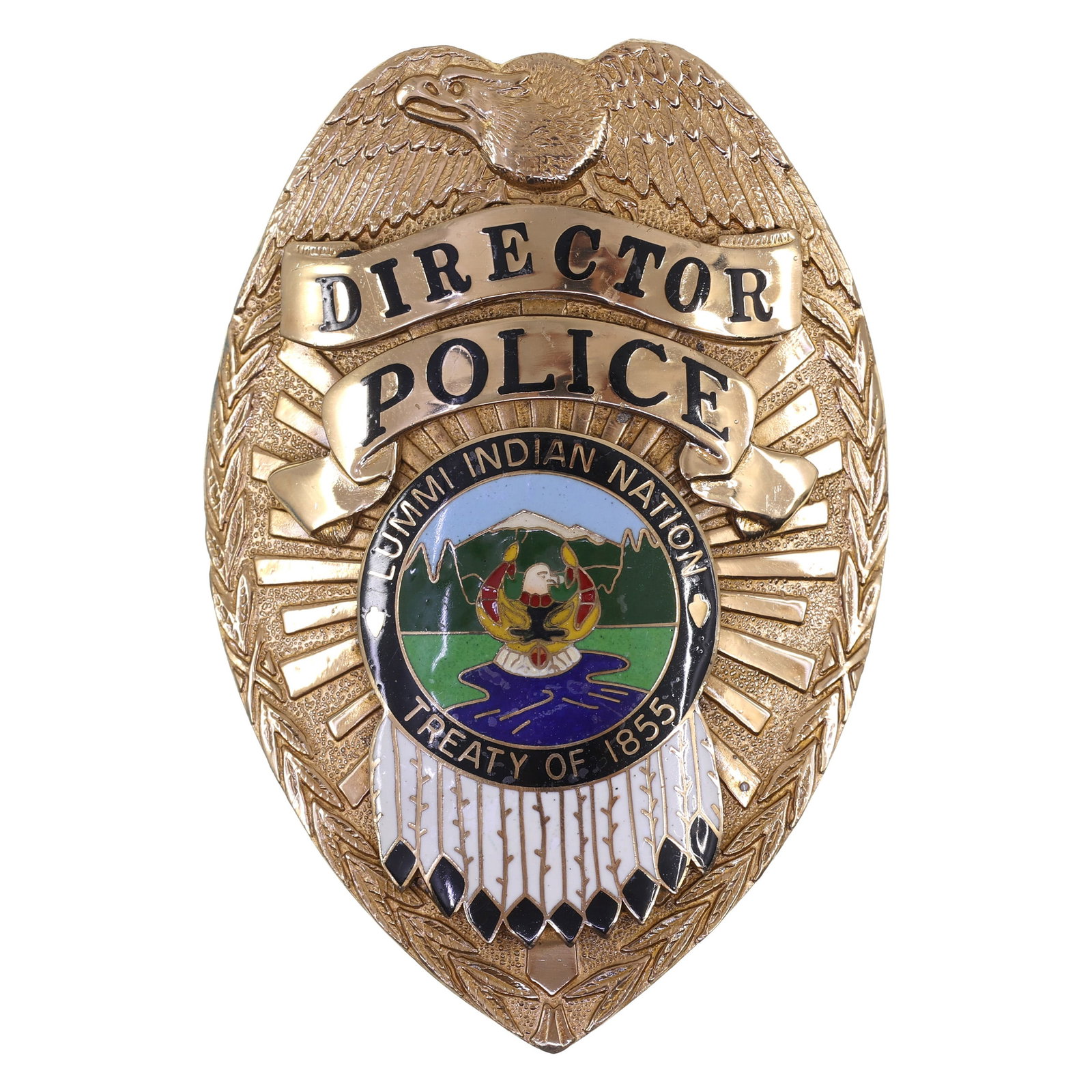 OBSOLETE LUMMI INDIAN NATION POLICE DIRECTOR BADGE: OBSOLETE LUMMI INDIAN NATION POLICE DIRECTOR BADGE Obsolete Lummi Indian Nation, Washington Police Director Badge. Maker marked by TCI Custom Insignia on the reverse. Measurements: 2" - 3" IMPORTANT N