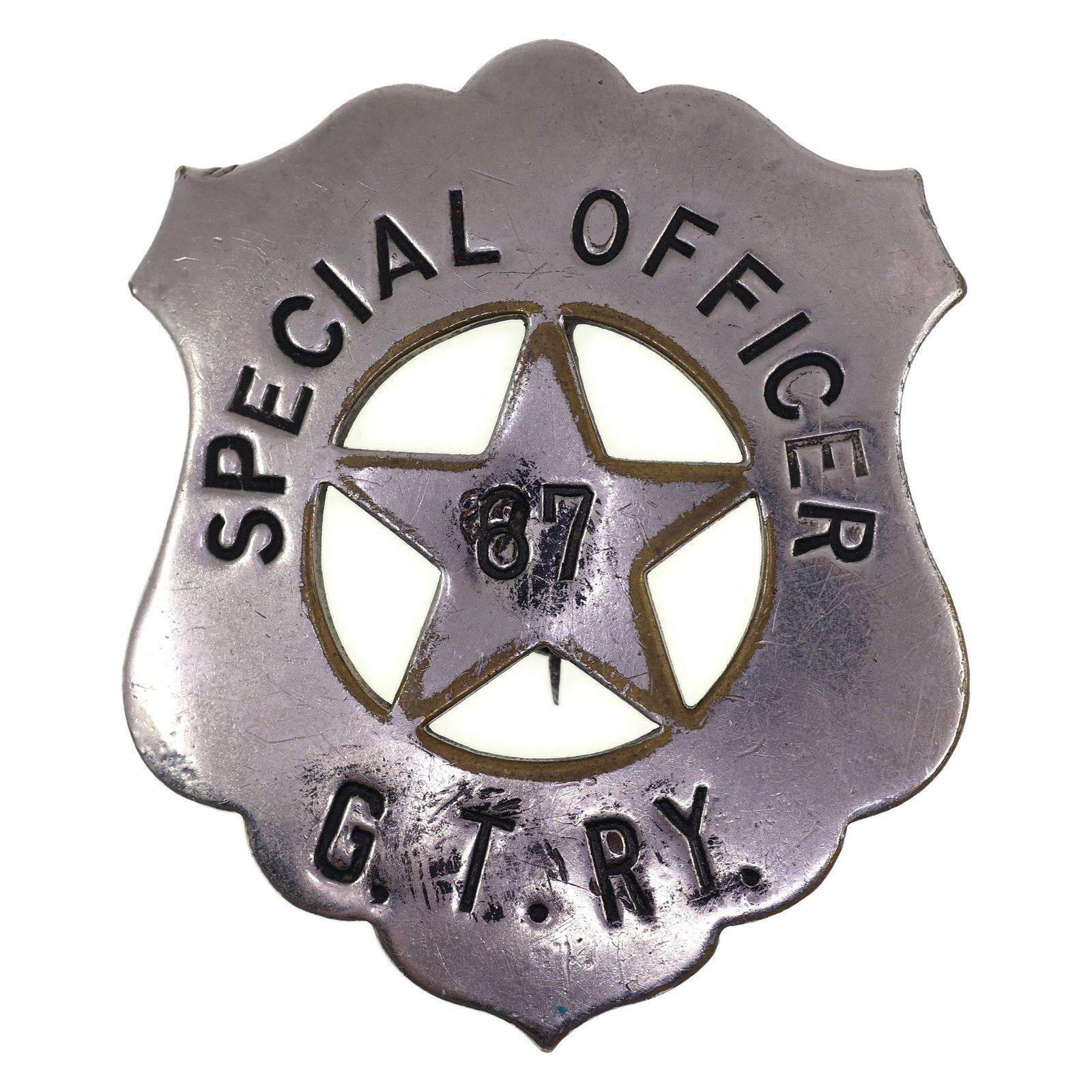 OBSOLETE GRAND TRUNK RAILWAY SPECIAL OFFICER BADGE #87: OBSOLETE GRAND TRUNK RAILWAY SPECIAL OFFICER BADGE #87 Obsolete Grand Trunk Railway Special Officer Badge, number 87 Measurements: 1.5"x1.75" IMPORTANT NOTE - PLEASE READ: OUR IN-HOUSE SHIPPING &
