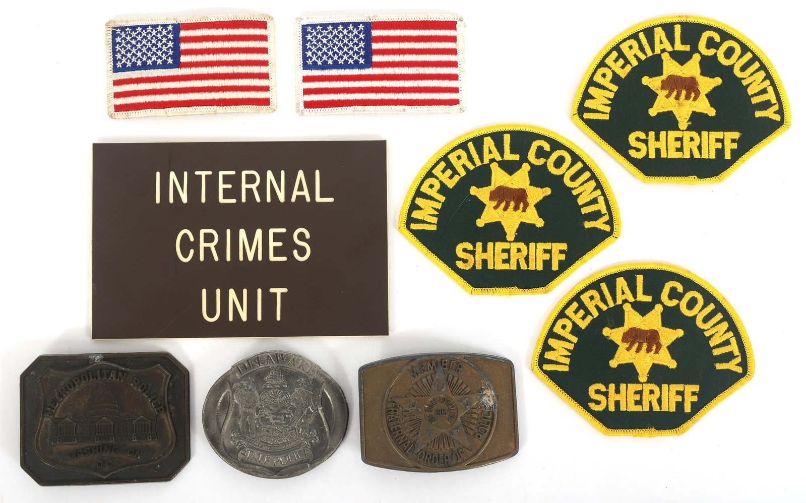 OBSOLETE LAW ENFORCEMENT PATCHES, BUCKLES, & SIGN (1 of 5)