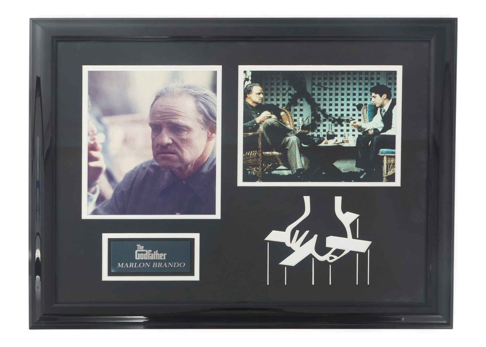 MARLON BRANDO SIGNED PHOTO FROM "THE GODFATHER": MARLON BRANDO SIGNED PHOTO FROM "THE GODFATHER" Framed photograph pair from "The Godfather" (1972) film. The portrait on the left is signed by actor Marlon Brando, 7.25 x 9.5". Includes