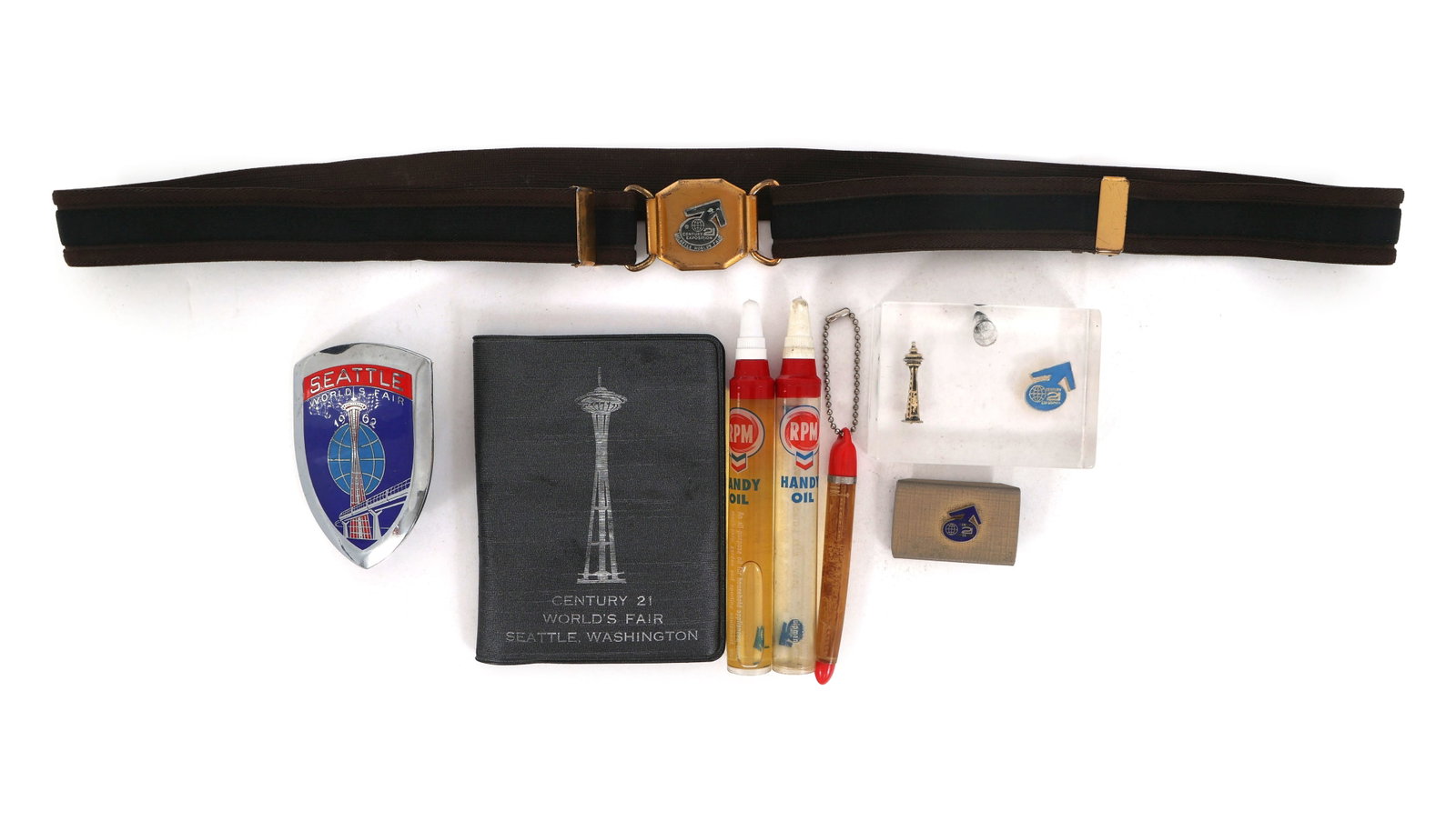 SEATTLE WORLD'S FAIR 1962 SOUVENIRS: SEATTLE WORLD'S FAIR 1962 SOUVENIRS 1962 Seattle World's Fair souvenirs: Uniform adjustable belt Resin pen holder (3" x 2" x .75") Bumper badge (2.5" x 3") Belt buckle (1.75"