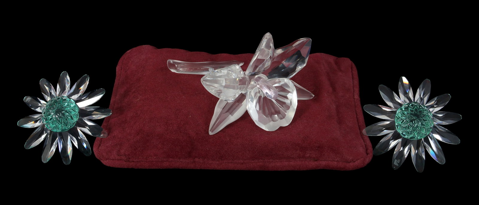 SWAROVSKI CRYSTAL FIGURINES - LOT OF 3: SWAROVSKI CRYSTAL FIGURINES - LOT OF 3 Swarovski Crystal Figurines. Includes: (2) SCS 2001 member renewal gift "Green Marguerite" #227537 "The Orchid" 7478 NR 000003 I