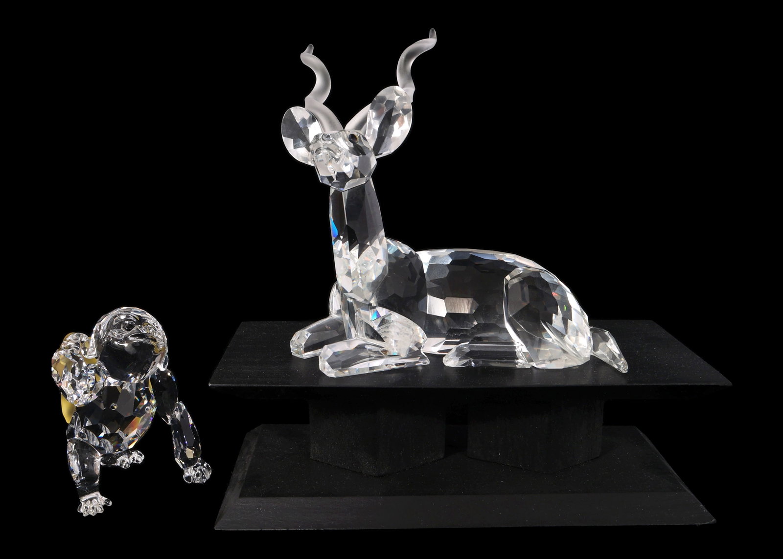 SWAROVSKI CRYSTAL FIGURINES - LOT OF 2: SWAROVSKI CRYSTAL FIGURINES - LOT OF 2 Swarovski Crystal Figurines. Includes: 1994 SCS Annual Edition: "The Kudu" #175703 (with base) Young Gorilla #273394 Includes or
