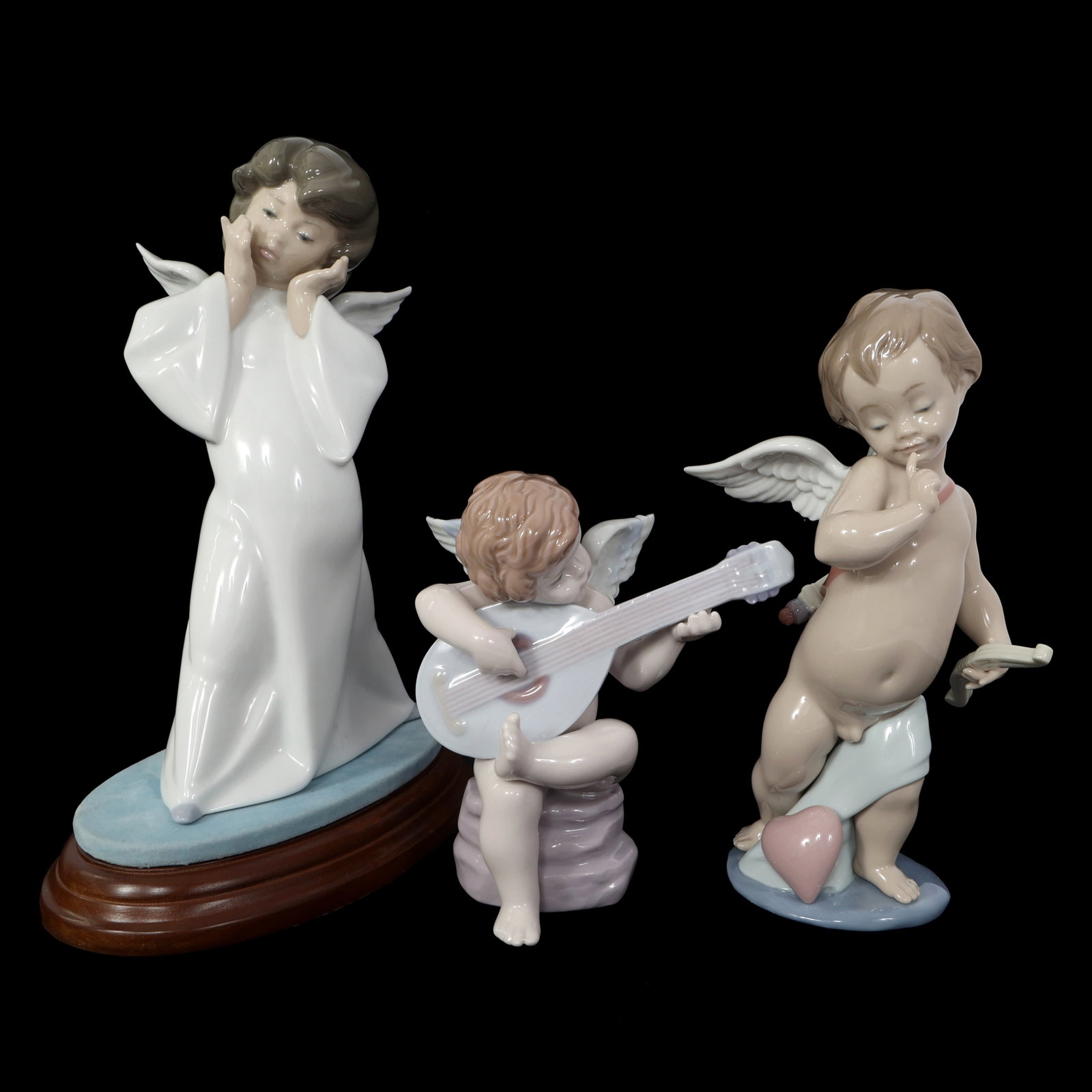 LLADRO PORCELAIN FIGURINES - LOT OF 3: LLADRO PORCELAIN FIGURINES - LOT OF 3 Lladro Porcelain Figurines. Includes: Cherub, Puzzled#04959 with base Cupid #06311 Allegro #06629 Includes original