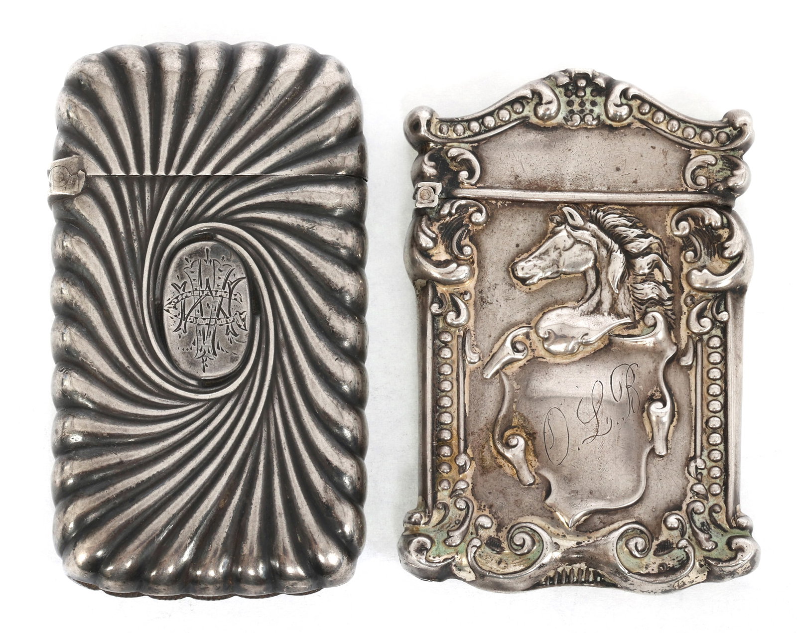 STERLING SILVER DECORATIVE VESTA MATCH CASES: STERLING SILVER DECORATIVE VESTA MATCH CASES Sterling silver vesta match cases: Gorham swirl pattern 1.5 x 2.5" Acanthus pattern with a horse head