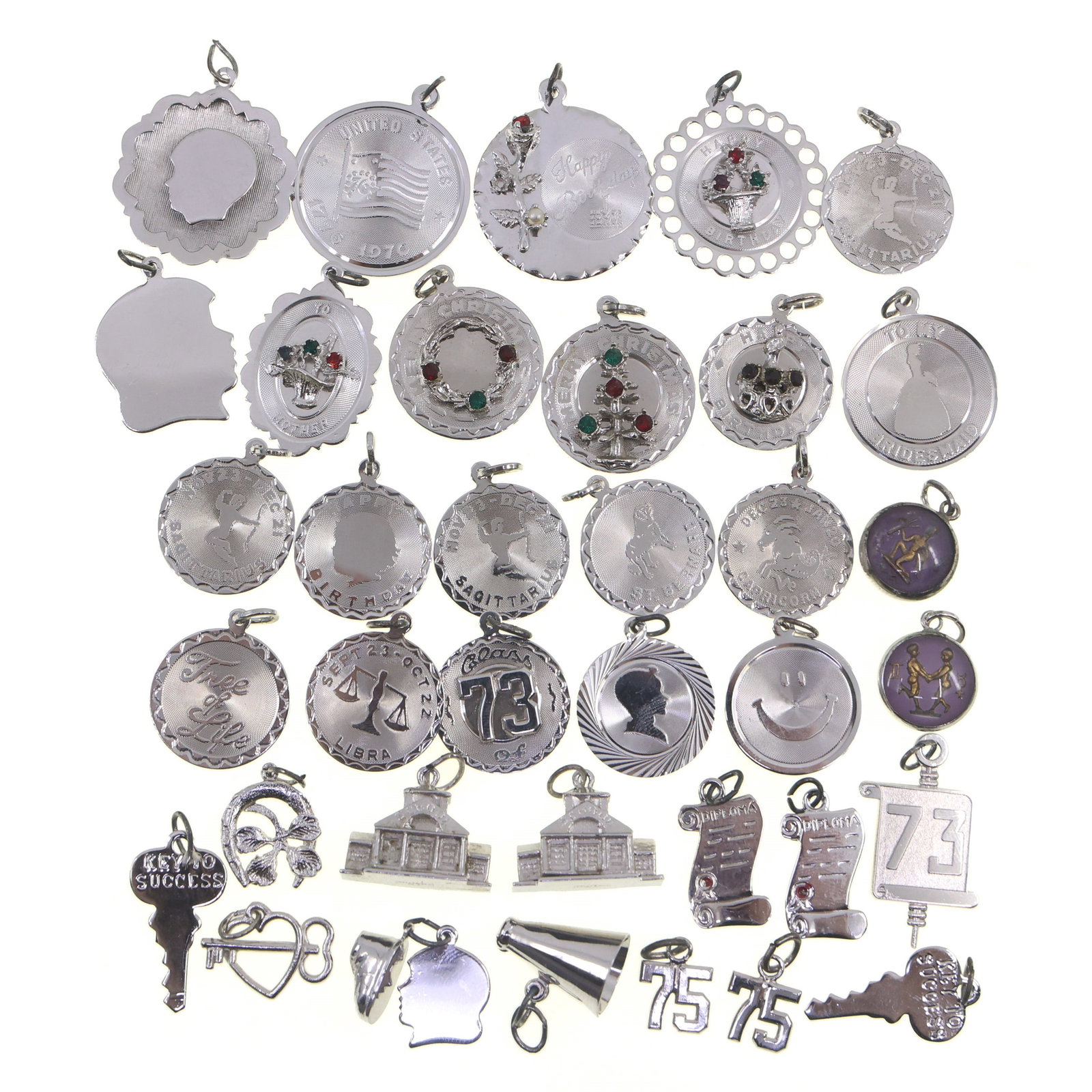 STERLING SILVER NOVELTY CHARMS: STERLING SILVER NOVELTY CHARMS Sterling silver novelty charms, themes include: Zodiac/astrology School hobbies Celebratory 1973 graduation Weight: 83g