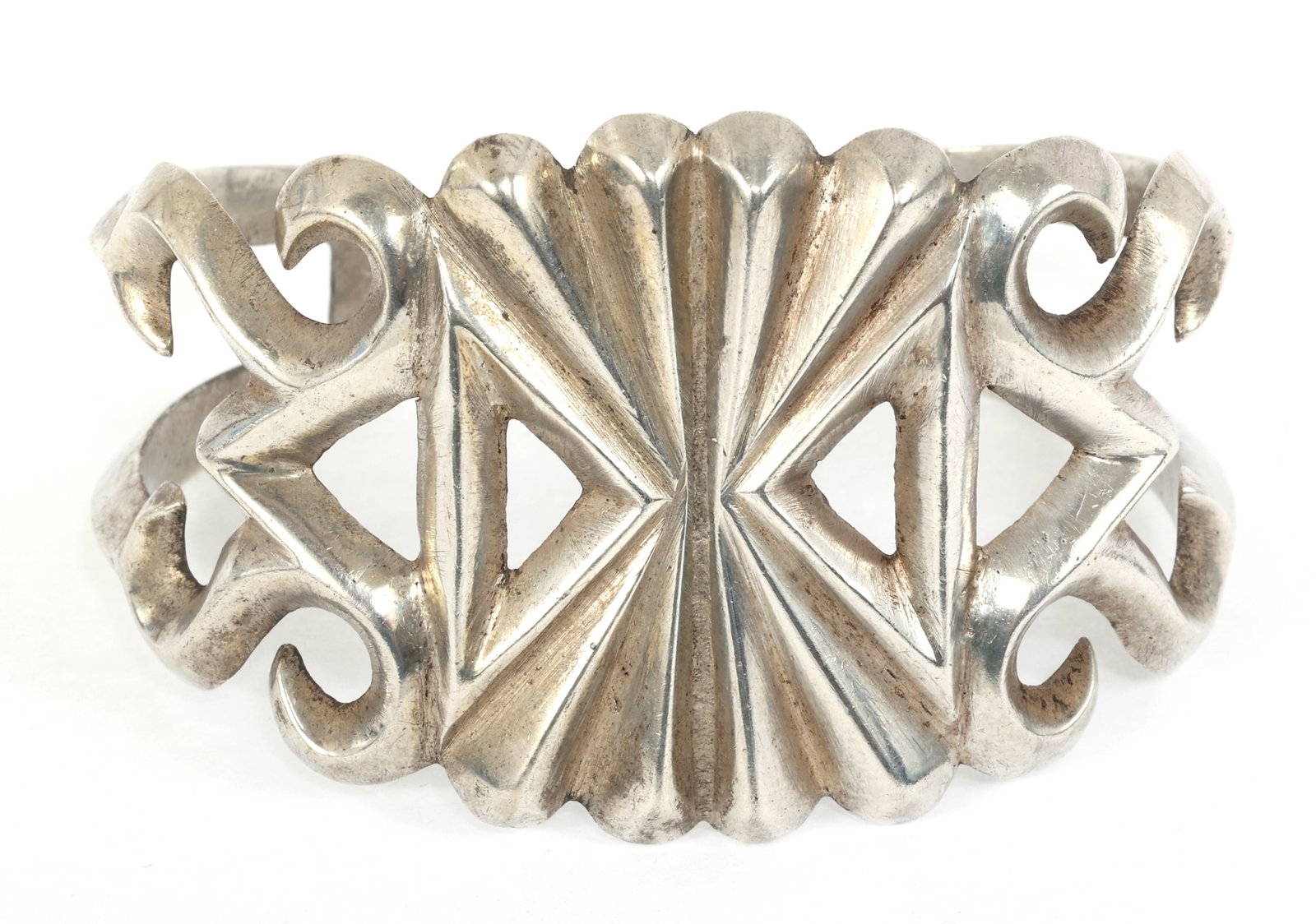 STERLING SILVER SANDCAST CUFF BRACELET: STERLING SILVER SANDCAST CUFF BRACELET Sterling silver sandcast cuff bracelet with symmetrical geometric design. Size: 6.5" Weight: 56g IMPORTANT NOTE - PLEASE READ: REGARDING OUR IN-HOUSE SHIPPING & 