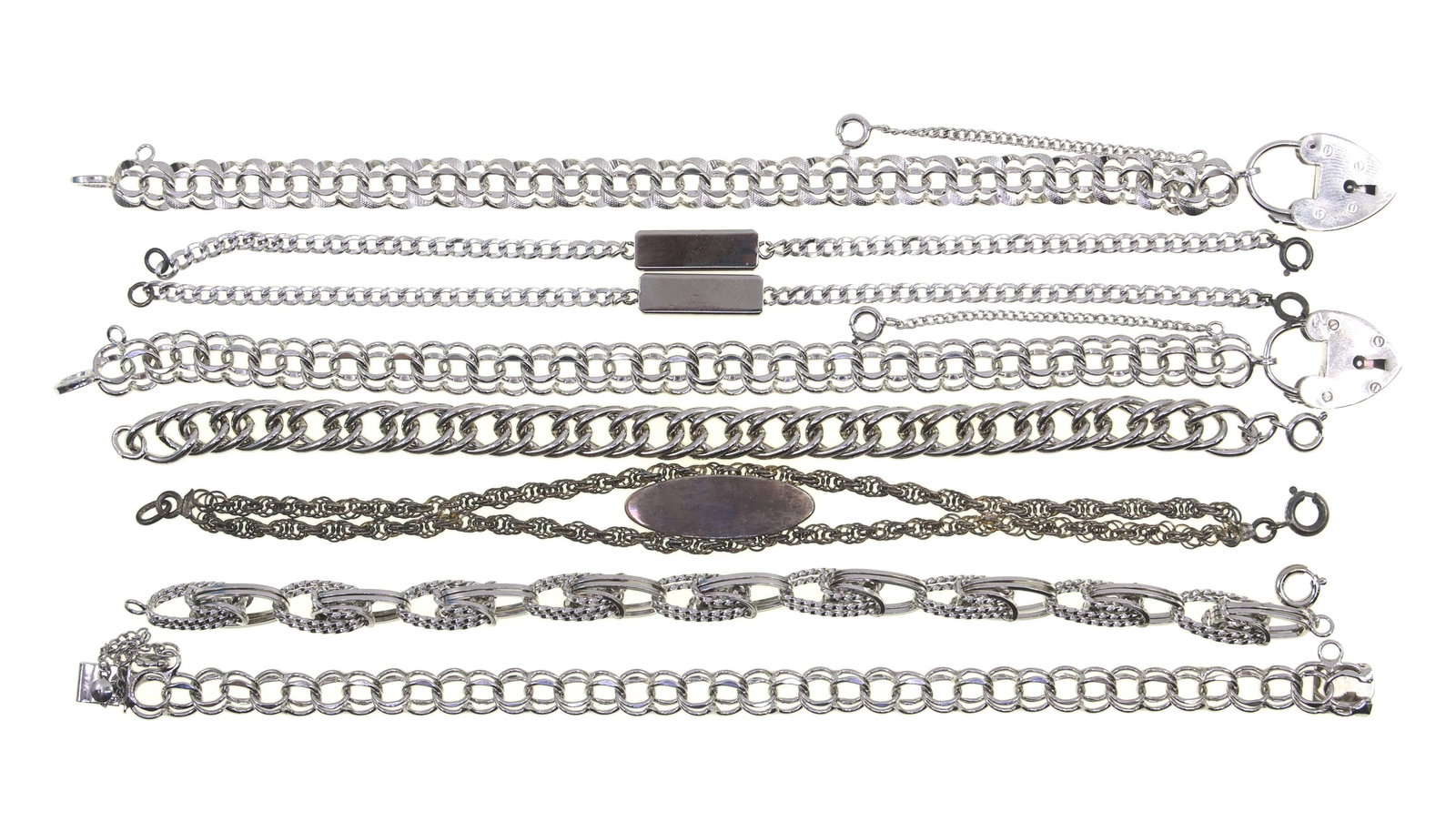 STERLING SILVER CHAIN FASHION BRACELETS: STERLING SILVER CHAIN FASHION BRACELETS Eight sterling silver chain fashion bracelets. Size: 7.25" to 8" Weight: 88g IMPORTANT NOTE - PLEASE READ: REGARDING OUR IN-HOUSE SHIPPING & INVOICING Shipping: