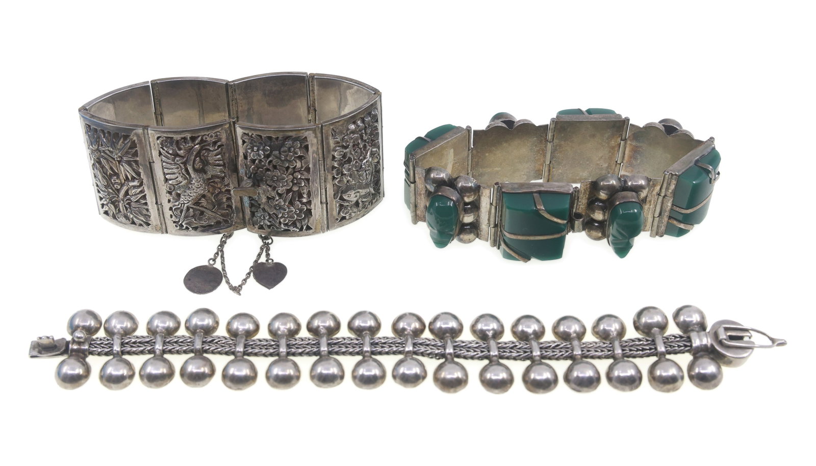 STERLING SILVER FASHION BRACELETS: STERLING SILVER FASHION BRACELETS Sterling silver fashion bracelets: Green onyx 7.25" Southeast-Asian design 7"