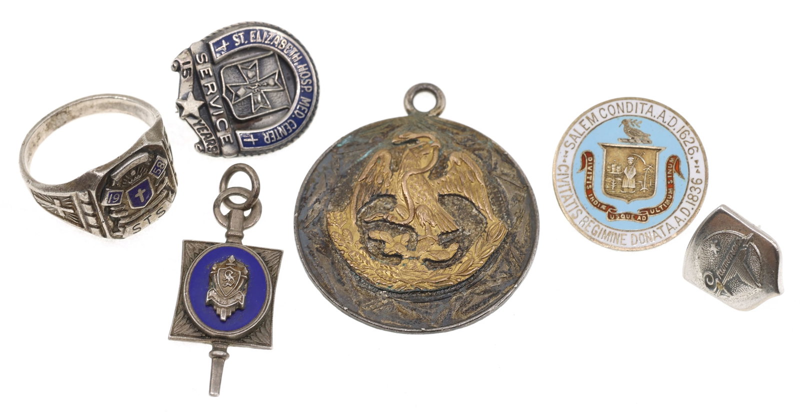 STERLING SILVER SERVICE PINS & INSIGNIA JEWELRY: STERLING SILVER SERVICE PINS & INSIGNIA JEWELRY Sterling silver service pins and insignia jewelry: City of Salem, MA, crest enamel pin St. Elizabeth Hospital Medical Center, 15-year service pin