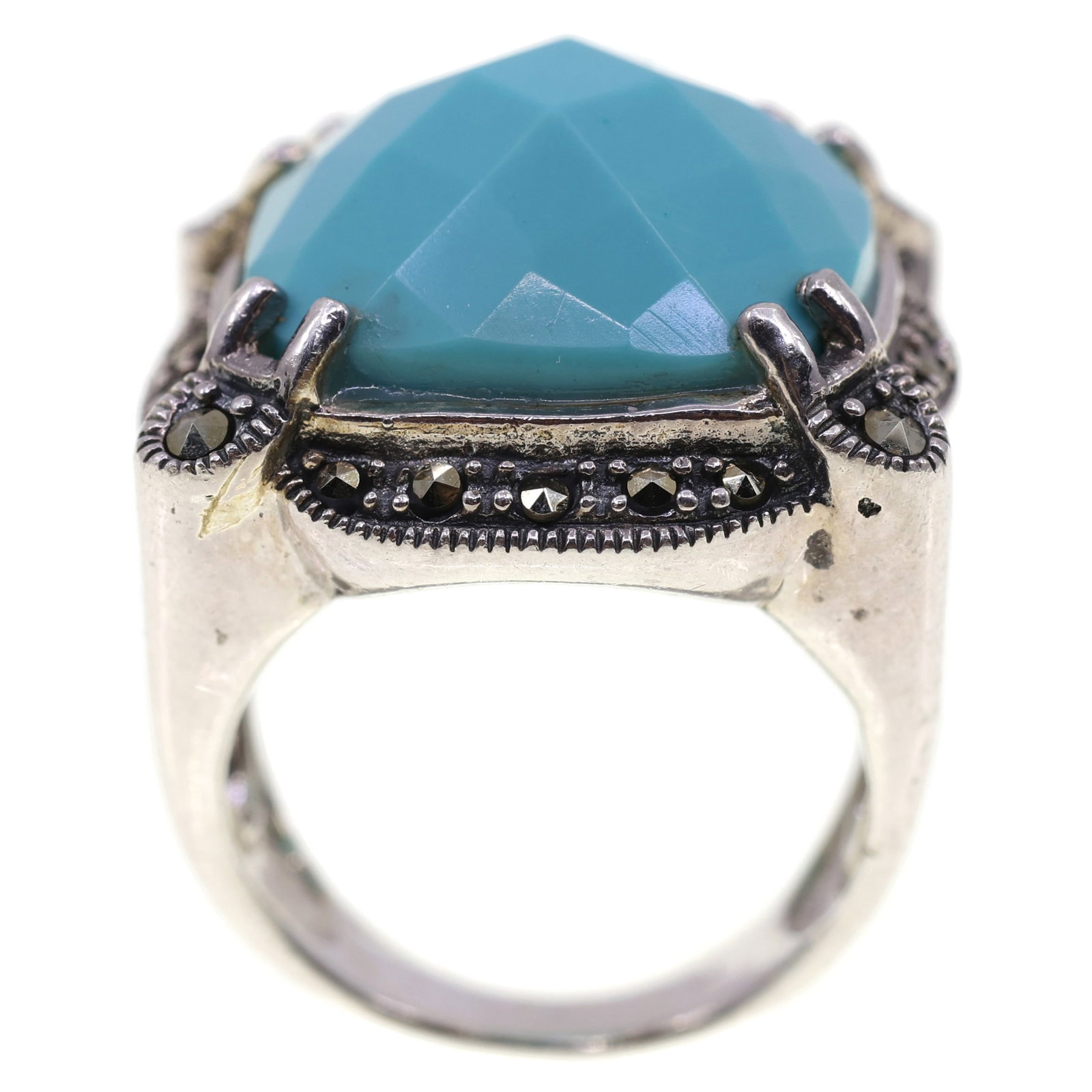 STERLING SILVER TURQUOISE & MARCASITE FASHION RING: STERLING SILVER TURQUOISE & MARCASITE FASHION RING Sterling silver turquoise & marcasite fashion ring: Cushion checkered board cut turquoise (18mm x 18mm) (22) Round marcasite (4) 2mm (18)
