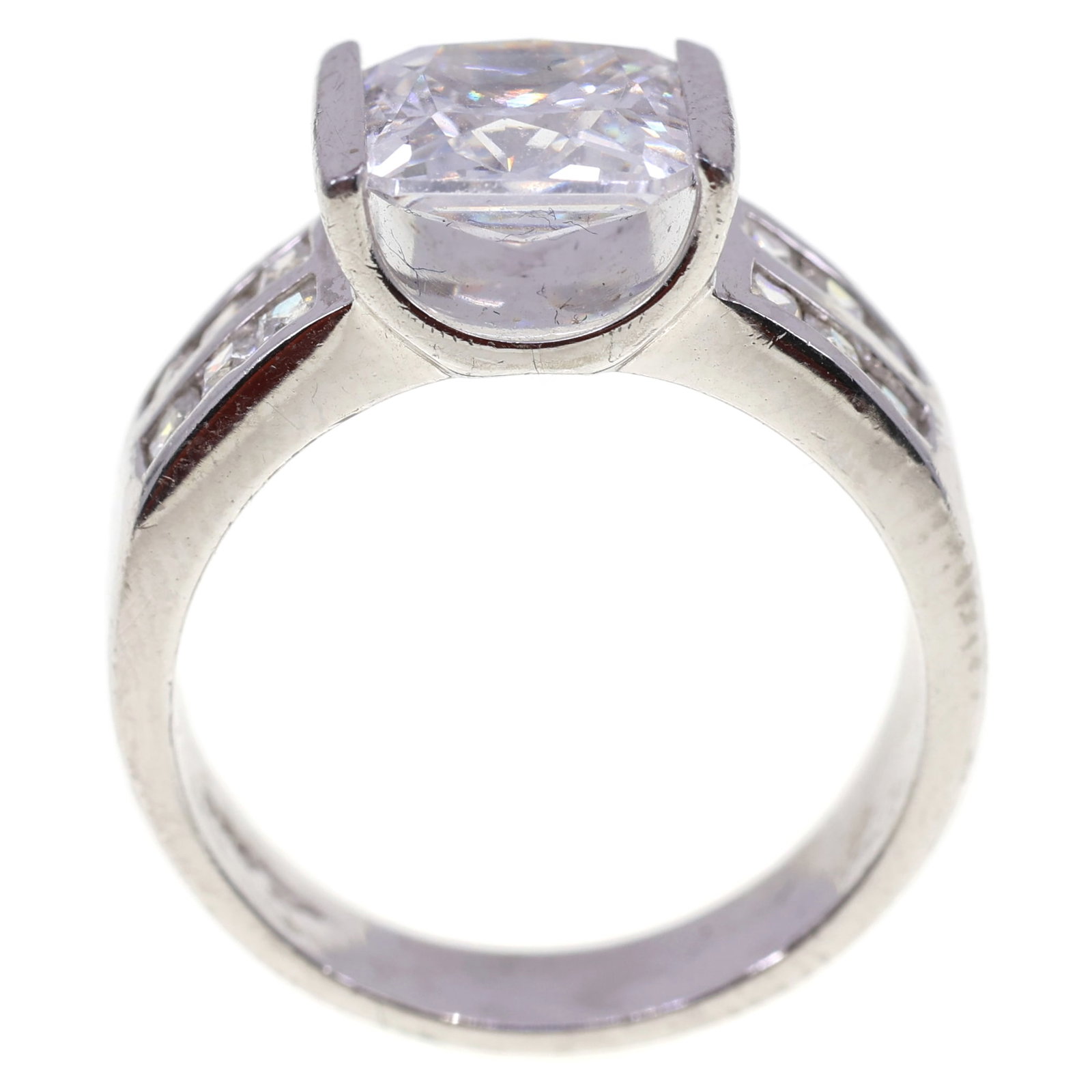 STERLING SILVER CUBIC ZIRCONIA ENGAGEMENT RING: STERLING SILVER CUBIC ZIRCONIA ENGAGEMENT RING Sterling silver princess cut cubic zirconia engagement ring, sizes include: 8mm (12) 2mm Size: 7.75 Weight: 8g IMPORTANT NOTE - PLEASE READ: