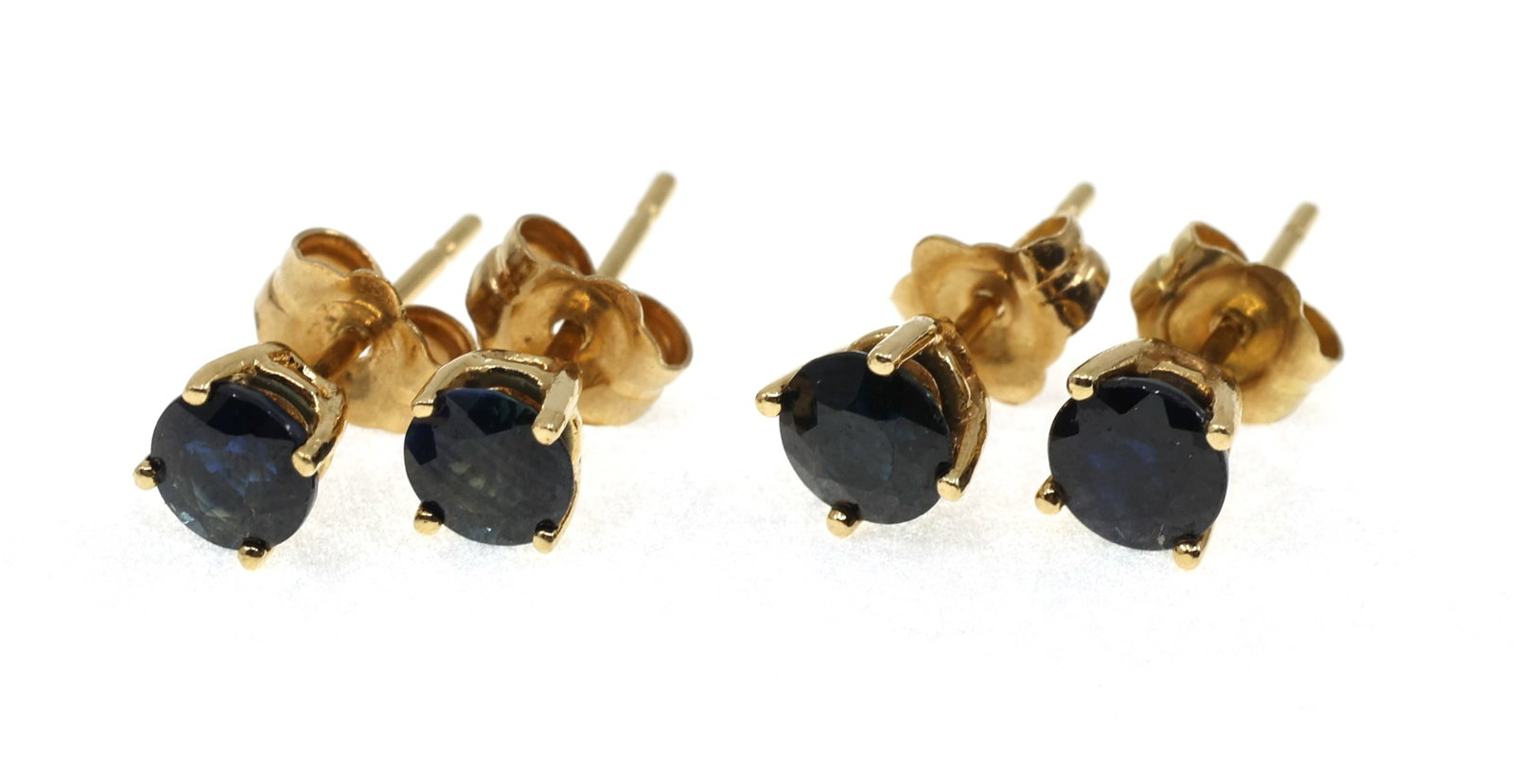 14K YELLOW GOLD BLUE SAPPHIRE SOLITAIRE EARRINGS: 14K YELLOW GOLD BLUE SAPPHIRE SOLITAIRE EARRINGS Two pairs of 14K yellow gold solitaire earrings: First pair 5mm blue sapphire Second pair 4.5mm blue sa