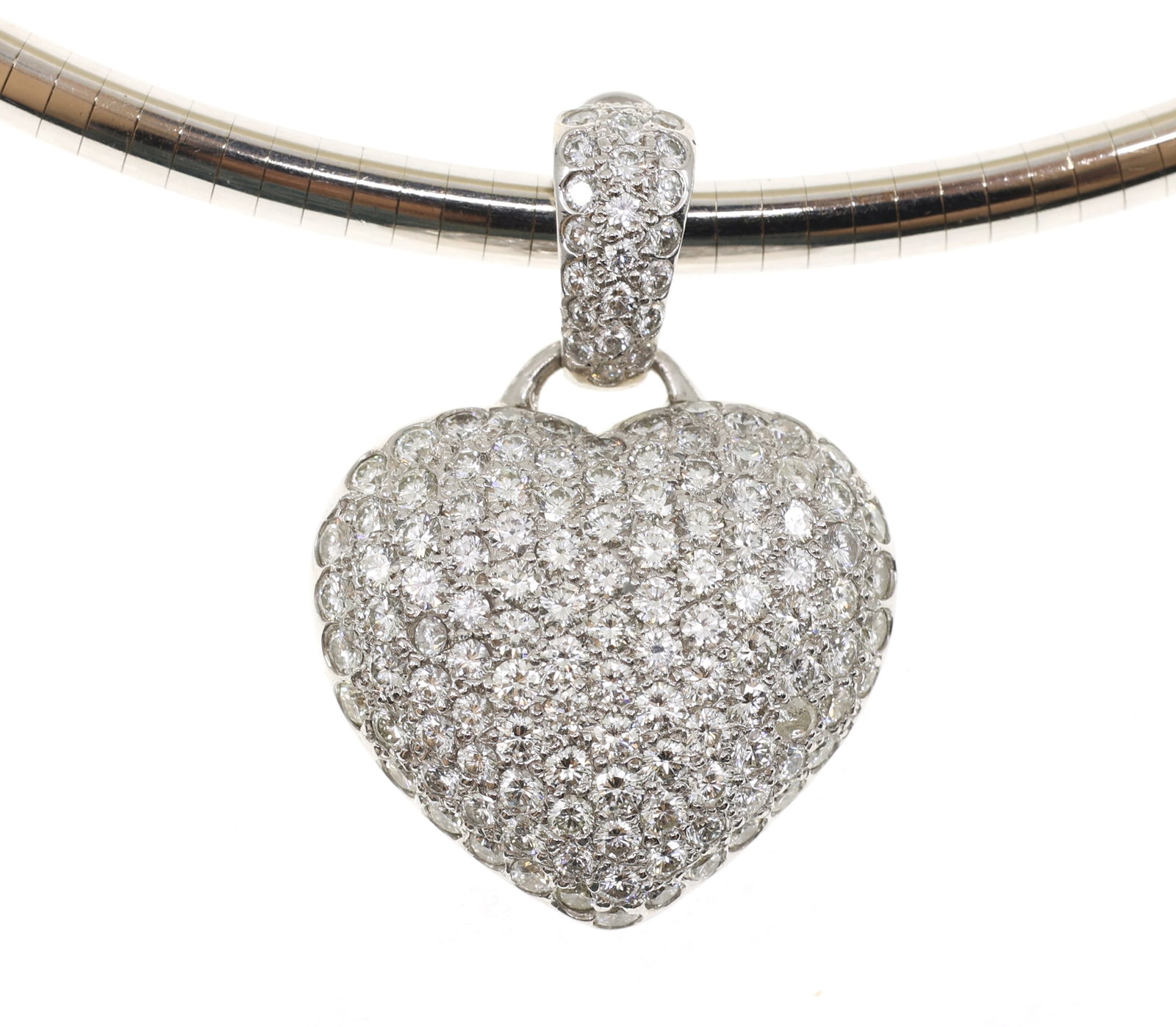 14K WHITE GOLD 3.38 CTW DIAMOND PAVE PENDANT & CHAIN: 14K WHITE GOLD 3.38 CTW DIAMOND PAVE PENDANT & CHAIN 14K white gold diamond pave heart pendant with a 16" omega chain: 3.38 ctw (142) round white diamonds Color: G-H Clarity: V
