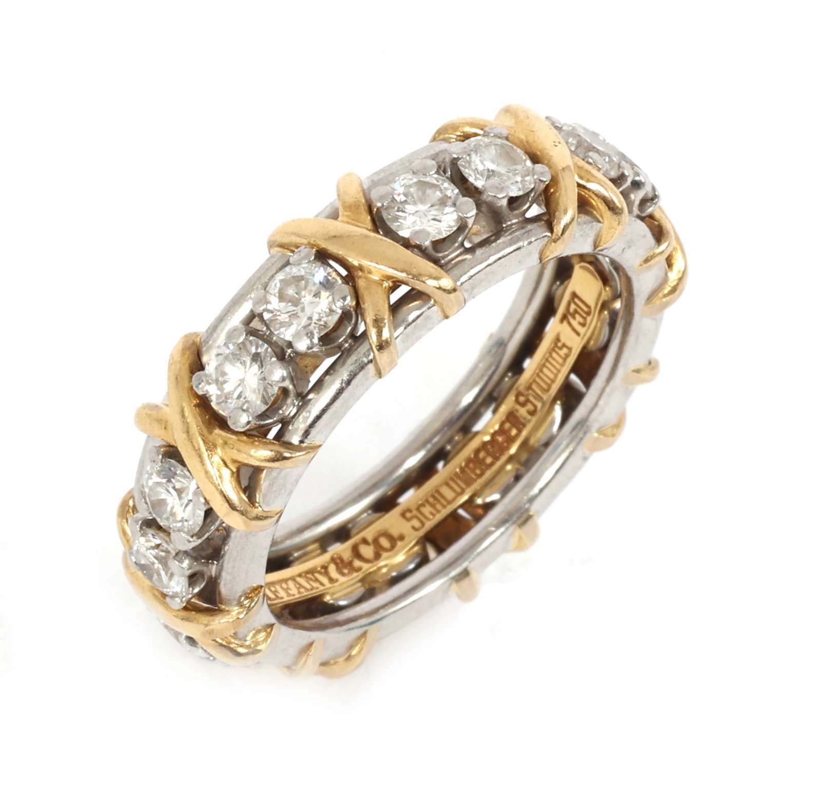 TIFFANY & CO. SCHLUMBERGER PLATINUM & 18K DIAMOND BAND: TIFFANY & CO. SCHLUMBERGER PLATINUM & 18K DIAMOND BAND Tiffany & Co., Schlumberger platinum and 18K Sixteen Stone eternity band: Diamonds, 1.28 ctw (16) 0.08 ct round 