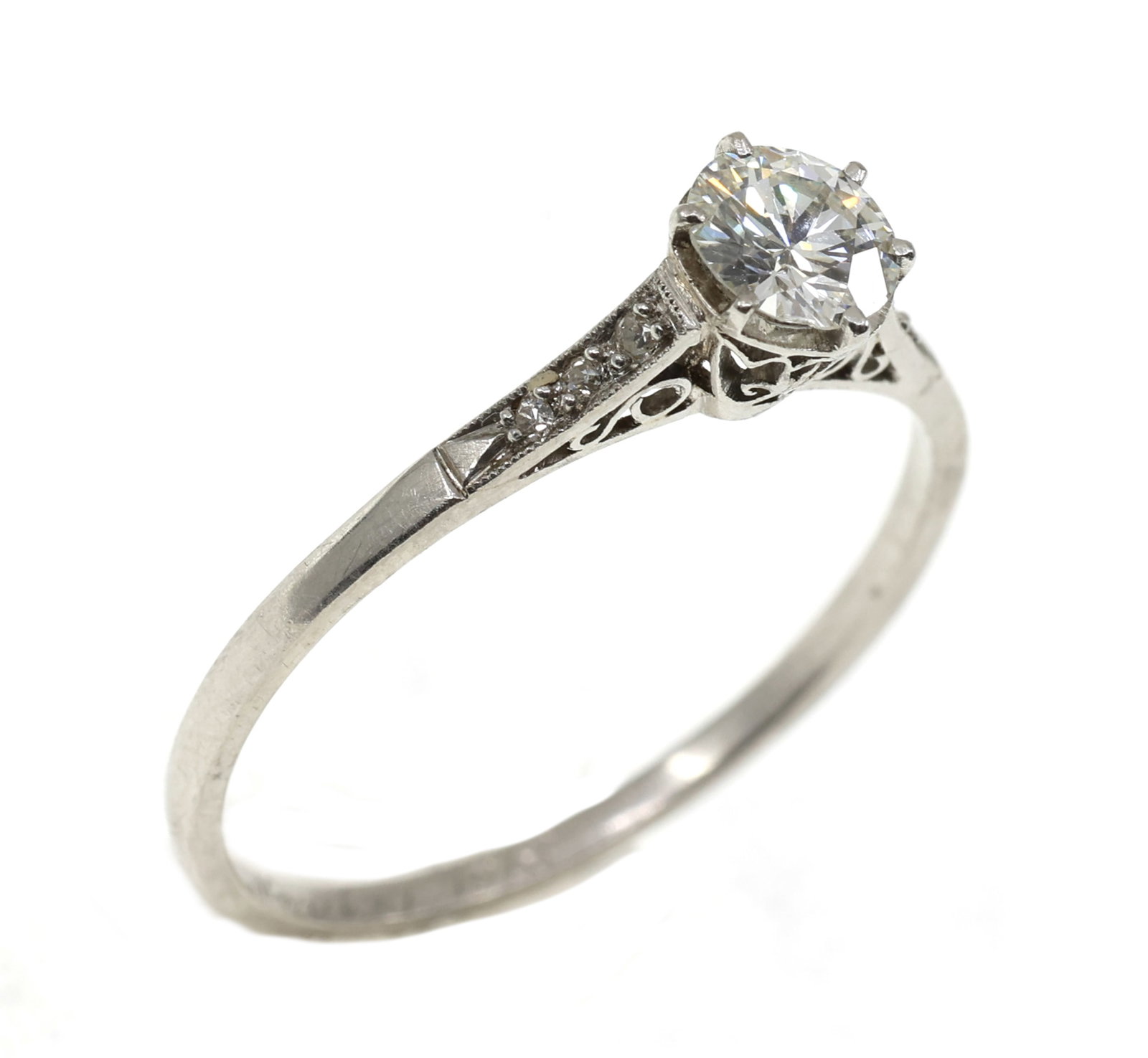 PLATINUM & 0.57 CTW ROUND DIAMOND ENGAGEMENT RING: PLATINUM & 0.57 CTW ROUND DIAMOND ENGAGEMENT RING Platinum and diamond engagement ring: Diamonds (1) 0.56 ct round (6) 0.0025 ct round Size