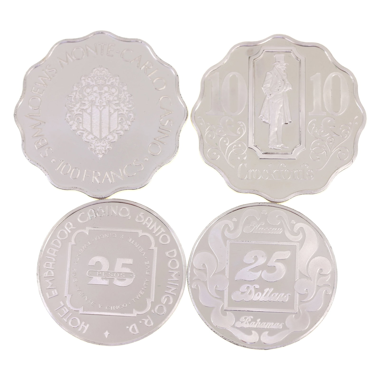 STERLING SILVER WORLD CASINO TOKENS BY FRANKLIN MINT: STERLING SILVER WORLD CASINO TOKENS BY FRANKLIN MINT Sterling silver "World's Great Casinos" gaming tokens by Franklin Mint. 103 g total weight. Includes: 25 pesos, Hotel Embajador Casino, Santo 