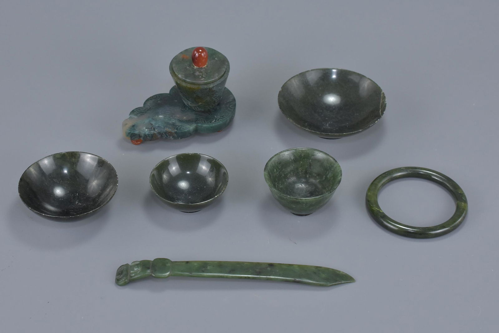 A group of seven Chinese jade items including a pot and (1 of 5)