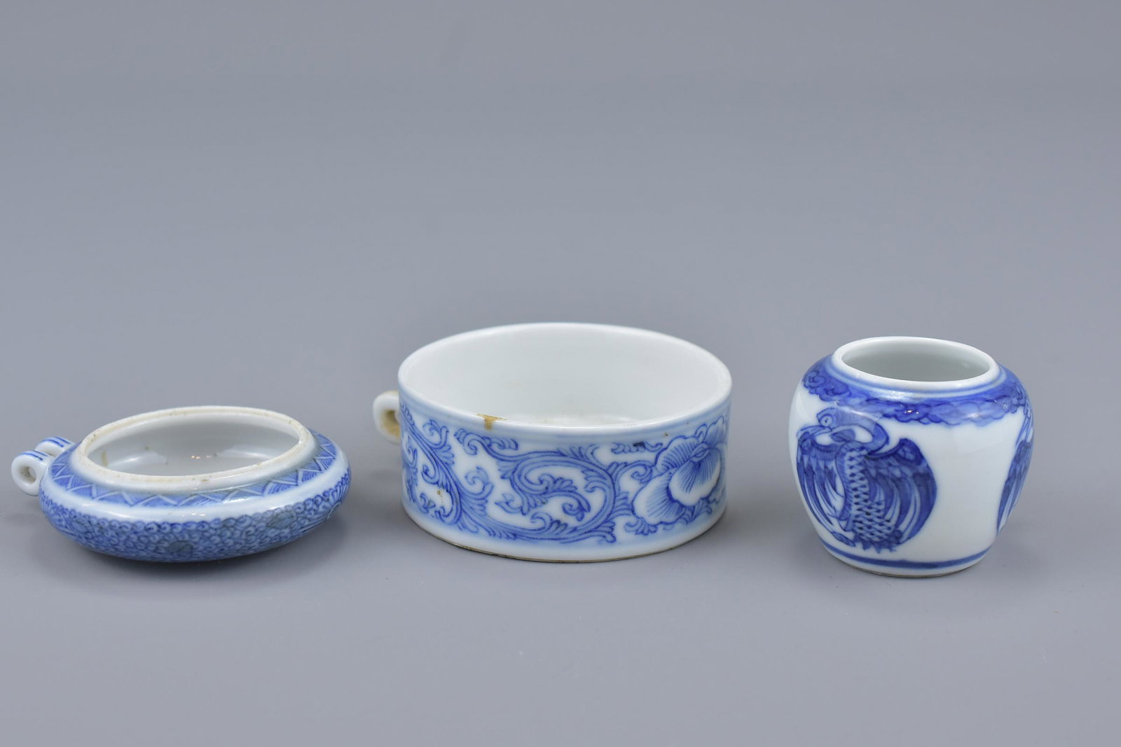 Three Chinese 19th Century blue and white porcelain: Three Chinese 19th Century blue and white porcelain bird feeders in various forms. (3) Provenance: From an English private collection purchased in 1960/70/80â€™s whilst living in Macao, Malaysia 