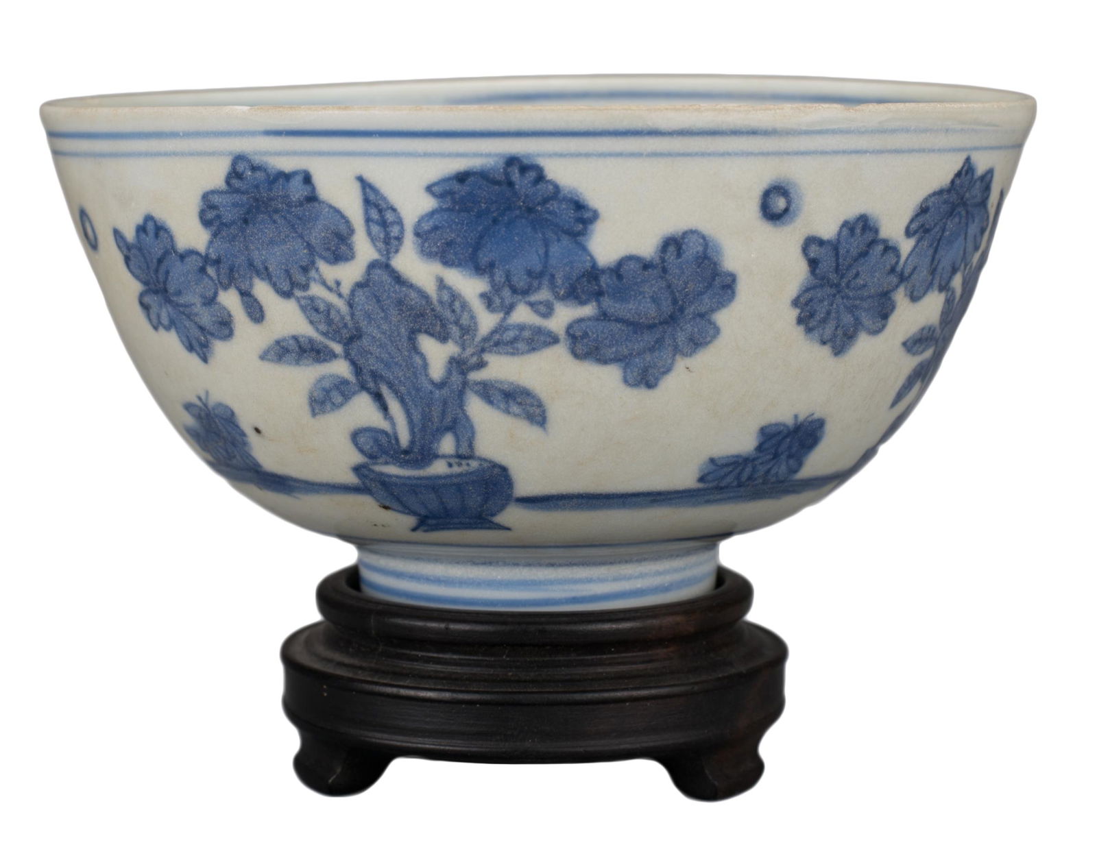 CHINESE BLUE AND WHITE PORCELAIN BOWL, MING DYNASTY: CHINESE BLUE AND WHITE PORCELAIN BOWL, MING DYNASTY, 16th CENTURY Decorated with pots of flowers. Four-character mark to base reading 'Yong bao chang chun' translating to 'Eternal life and everlasting