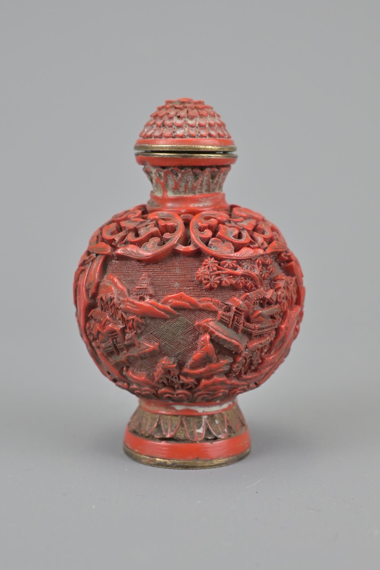 A 19th century chinese carved lacquer snuff bottle on a (1 of 7)