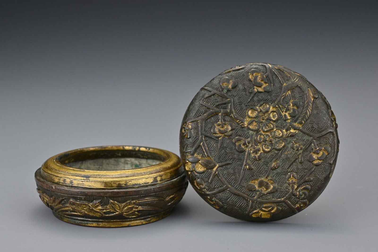 A Chinese parcel-gilt bronze incense box and cover. The (1 of 7)