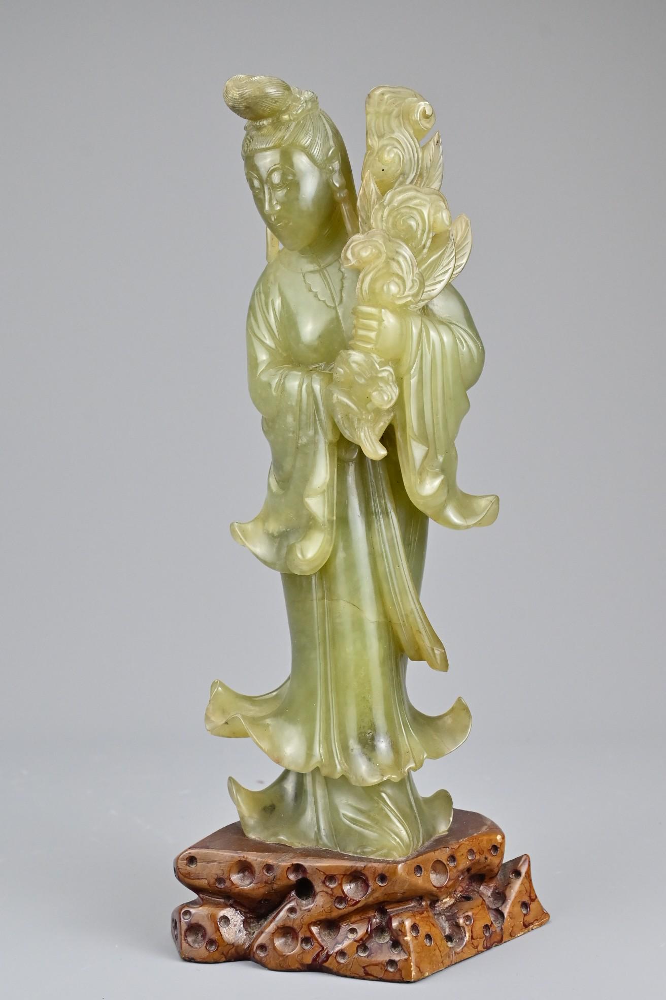 A Chinese early 20th Century carved jade figure of (1 of 7)