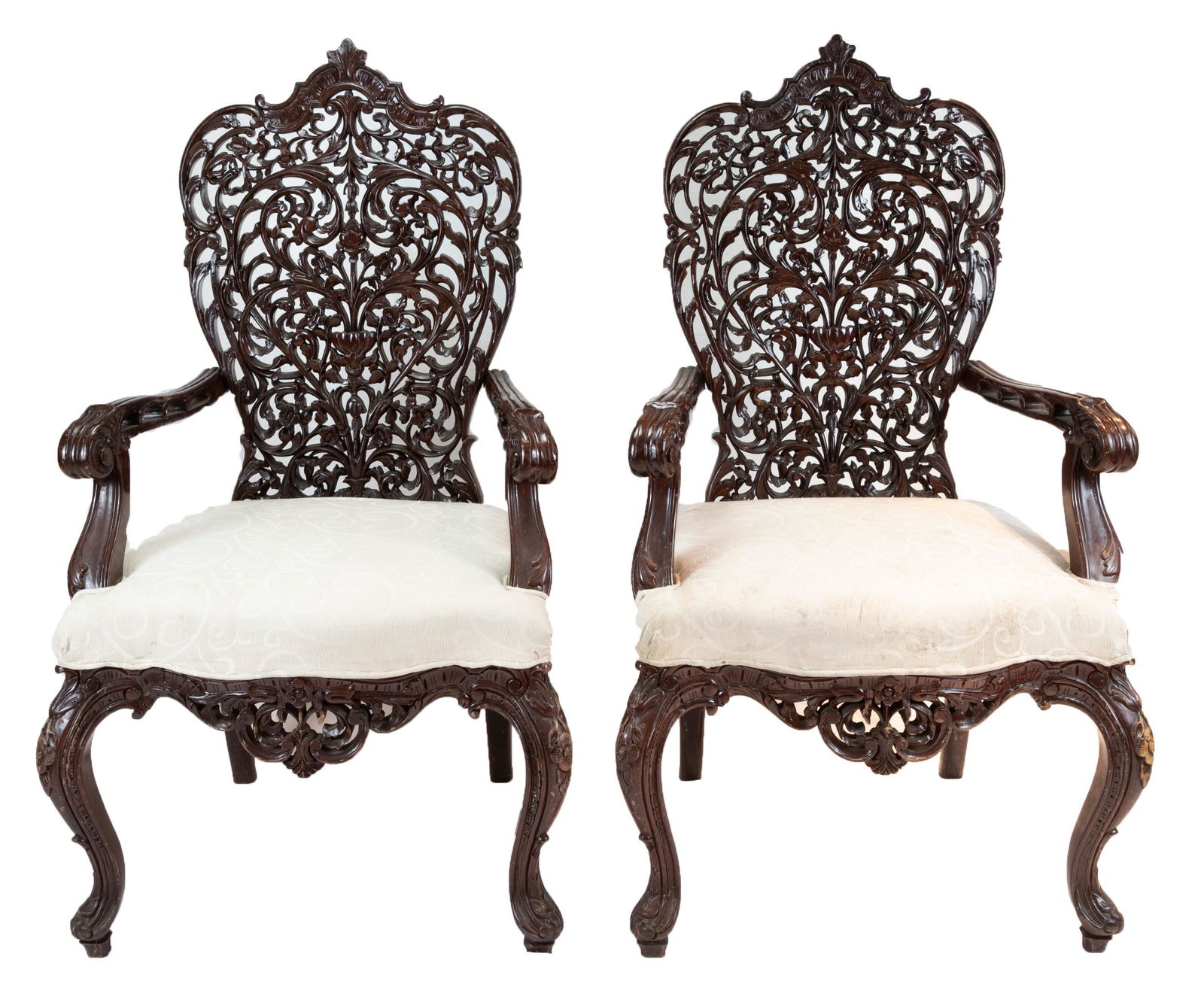A pair of Anglo-Indian hardwood armchairs, ornately (1 of 3)