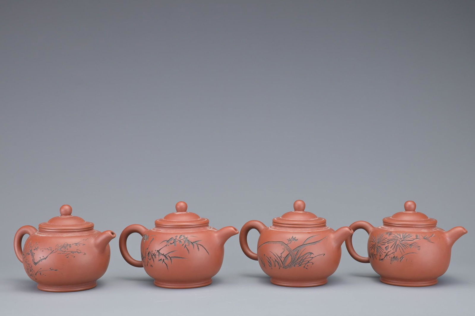 A SET OF FOUR CHINESE YIXING POTTERY TEAPOTS (1 of 8)