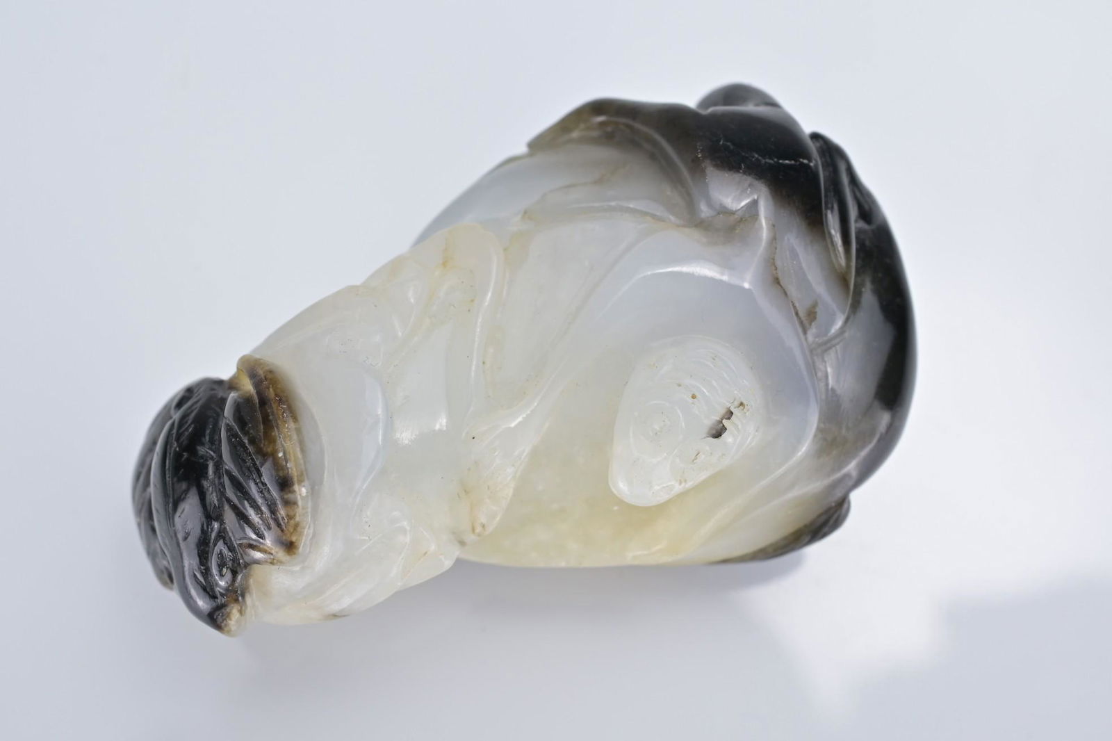 A CHINESE WHITE AND BLACK JADE PENDANT OF MONKEY AND BAT ON MELON (1 of 8)
