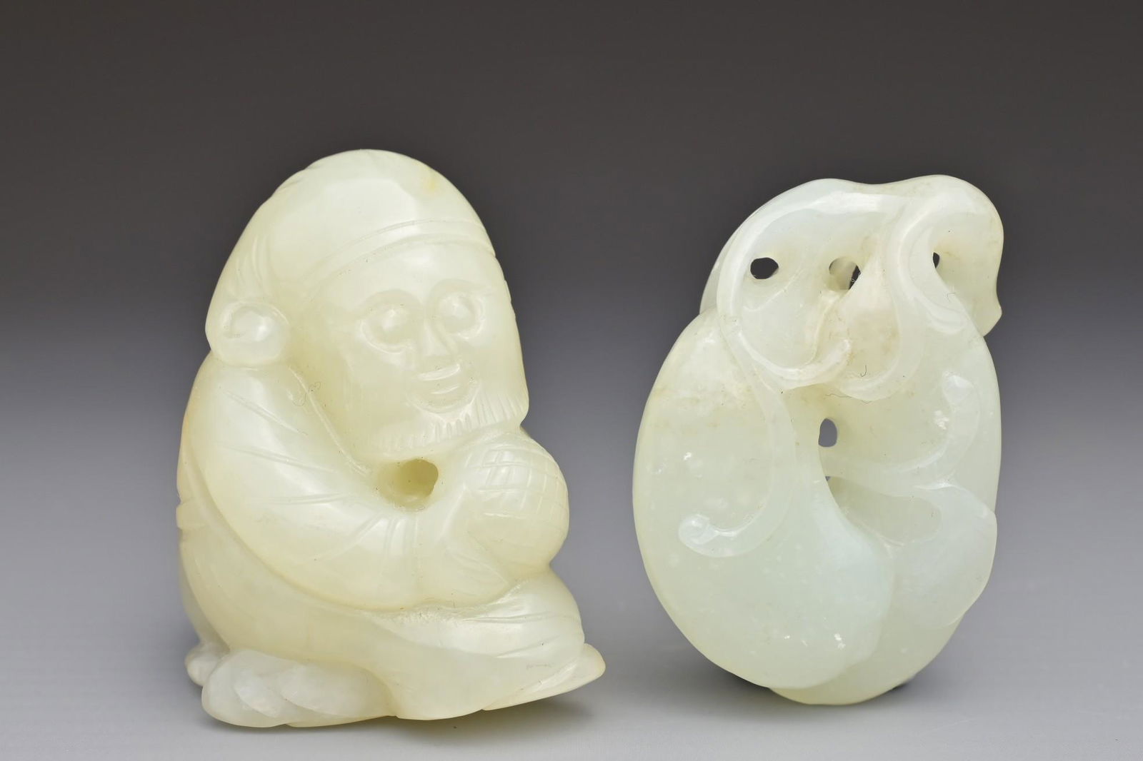 TWO CHINESE PALE CELADON JADE PENDANTS (1 of 8)