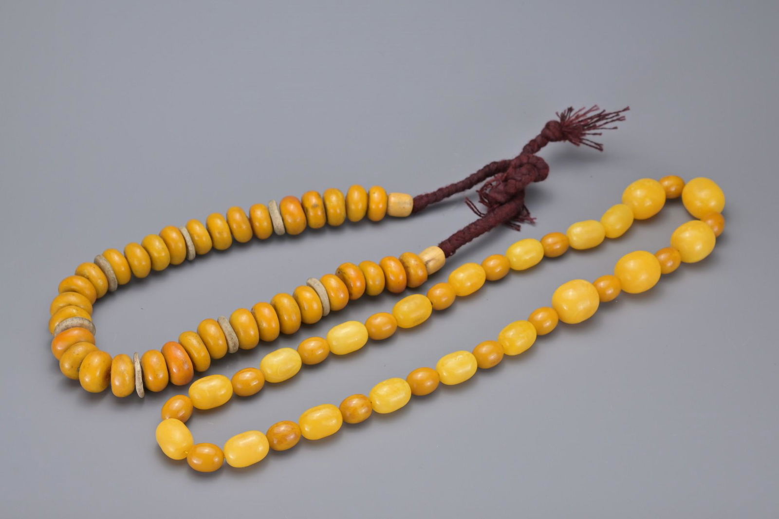 TWO AMBER COLOURED BEAD NECKLACES (1 of 5)