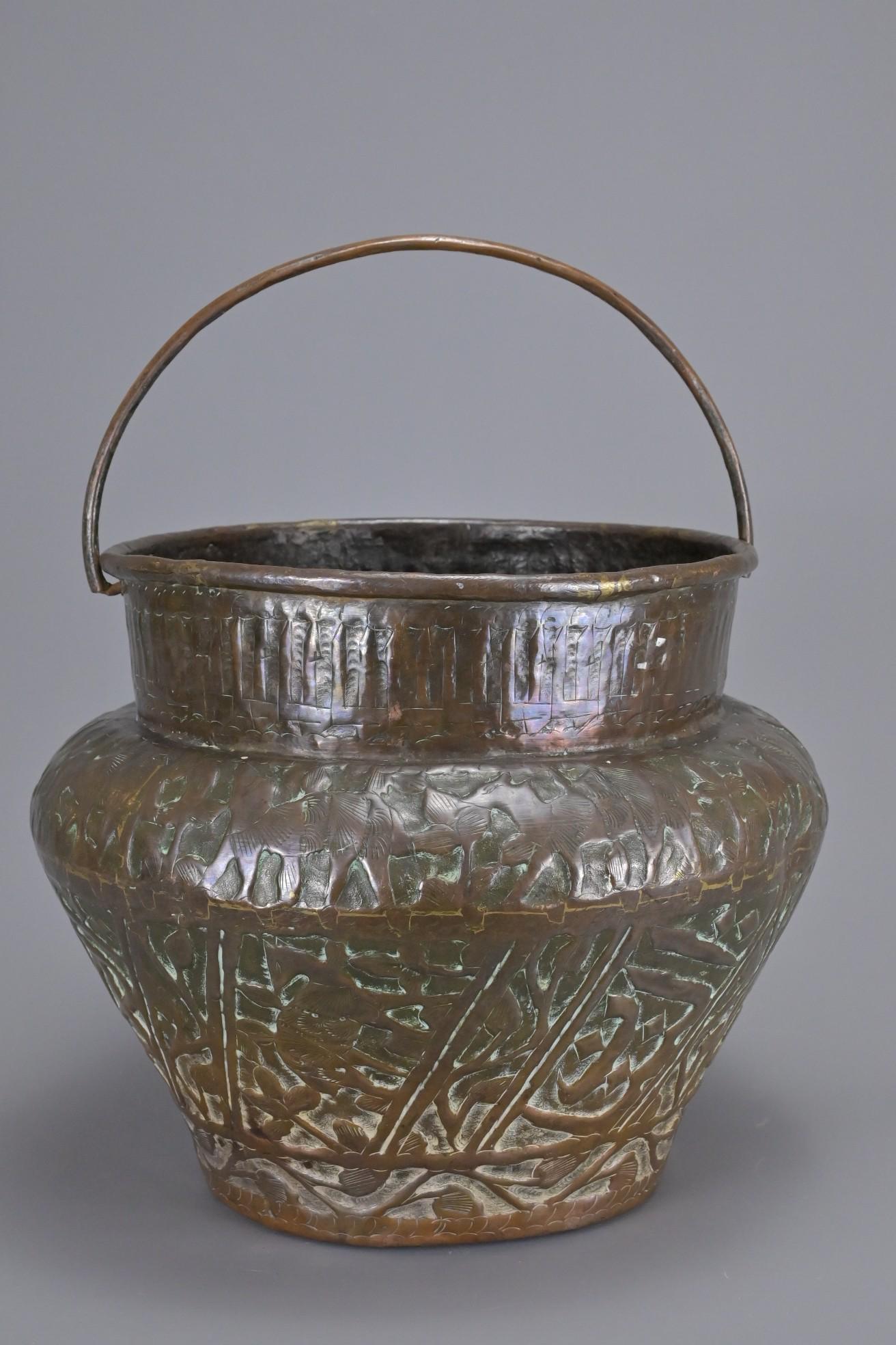 AN ANTIQUE MIDDLE EASTERN COPPER REPOUSSE CONTAINER (1 of 6)