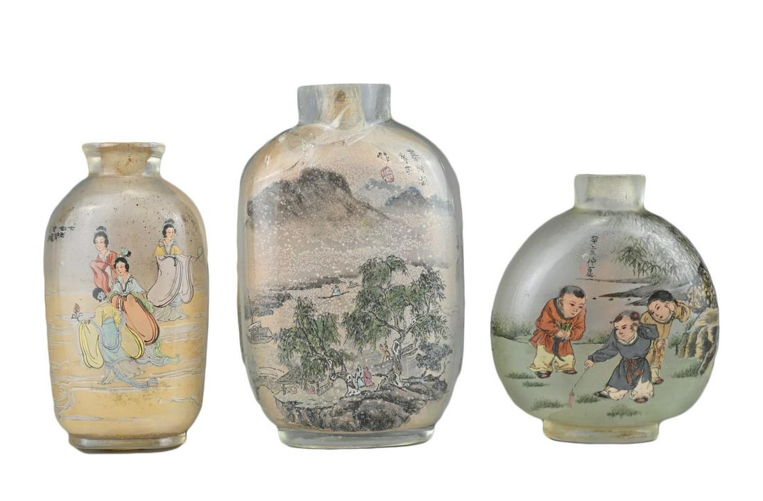 THREE CHINESE INSIDE-PAINTED GLASS SNUFF BOTTLES. Depicting various figures and landscape scenes. (1 of 6)