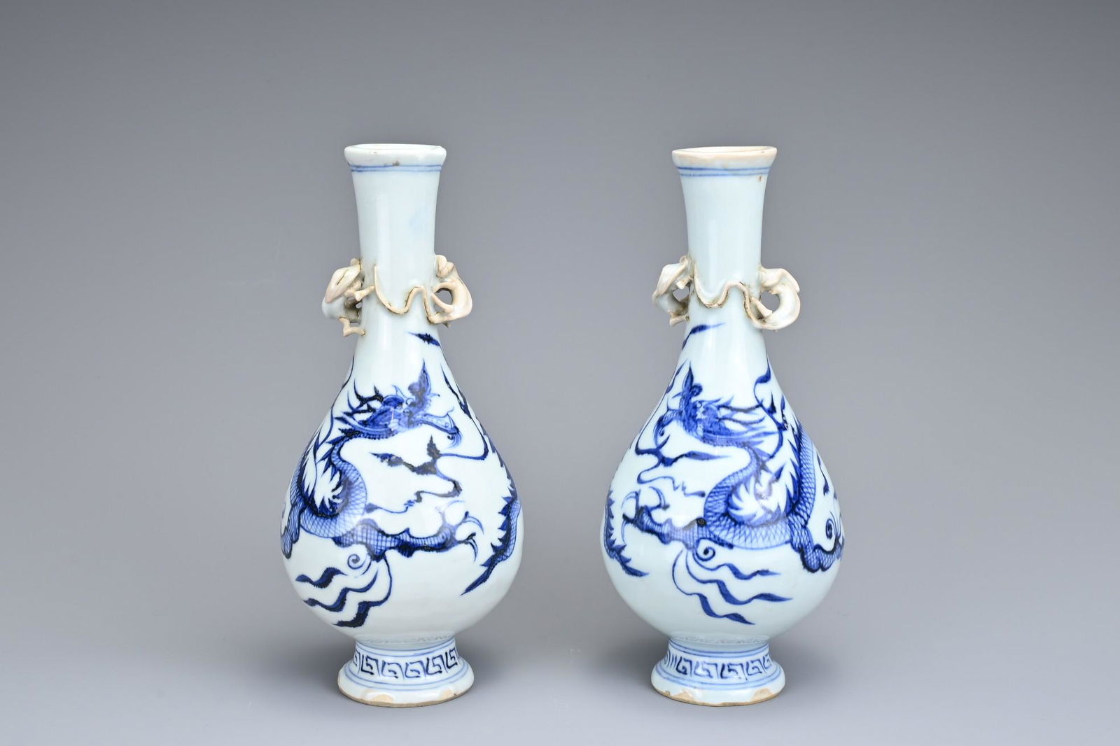 A PAIR OF CHINESE BLUE AND WHITE PORCELAIN BOTTLE VASES (1 of 6)