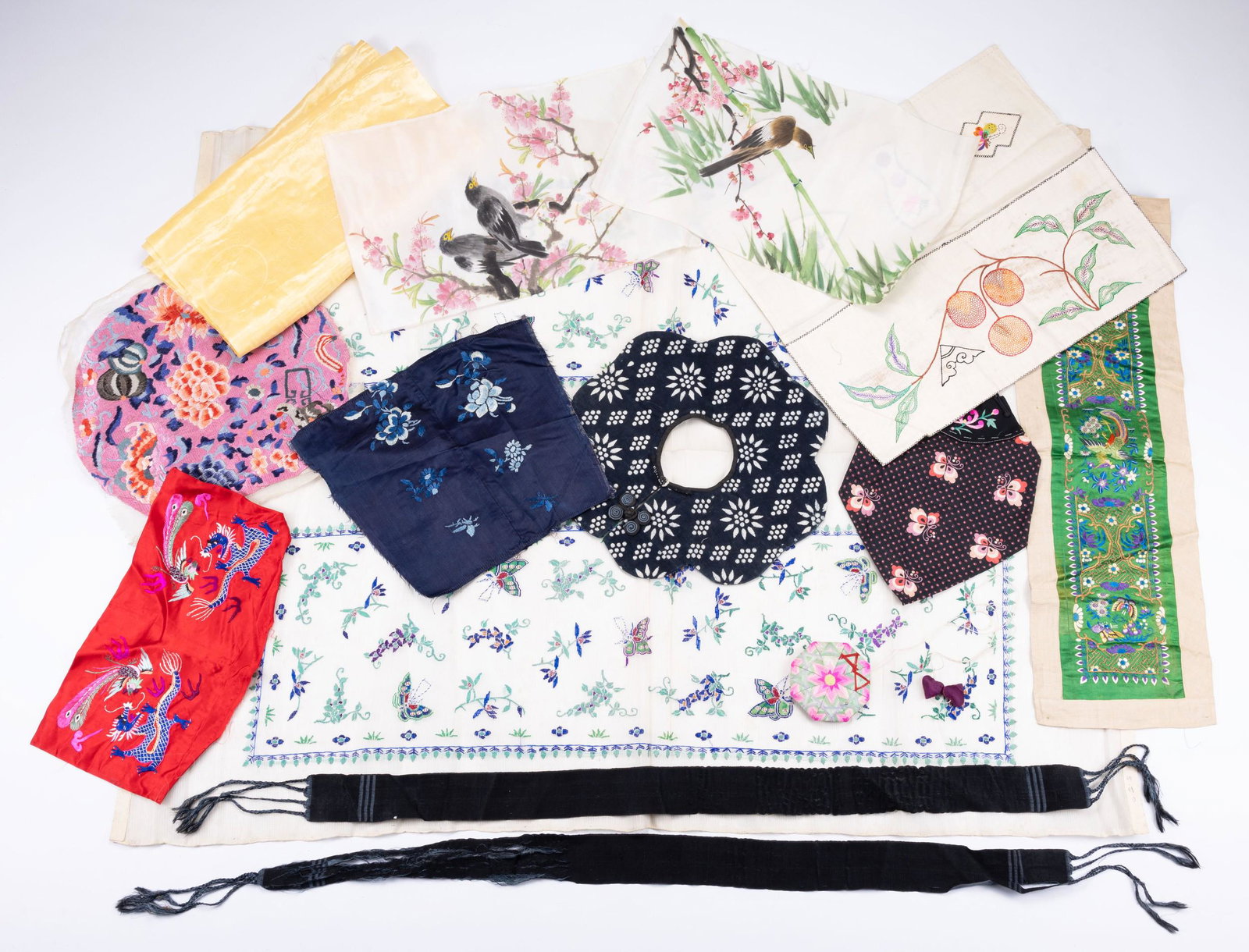 A COLLECTION OF CHINESE EMBROIDERED FRAGMENTS, COLLARS AND OTHER ITEMS. Including: a red silk (1 of 5)