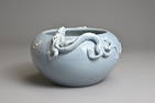 A CHINESE MONOCHROME BLUE GLAZED PORCELAIN BRUSH WASHER, YONGZHENG MARK. Rounded body with moulded