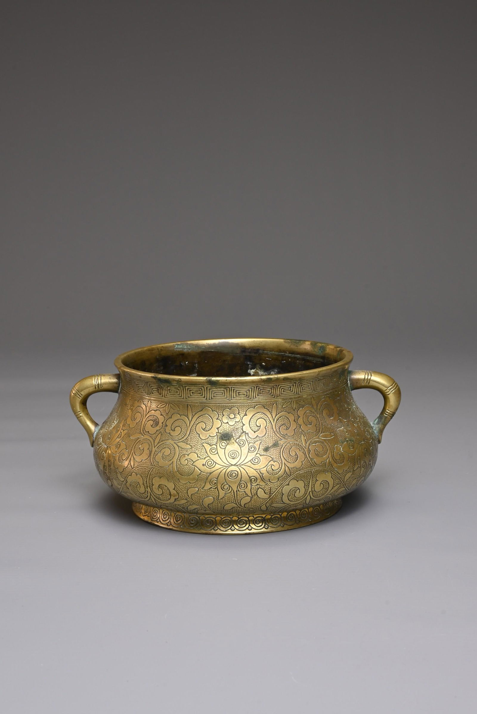A CHINESE BRONZE CENSER WITH PAVILION MARK, QING DYNASTY. Of circular form with twin handles and (1 of 8)