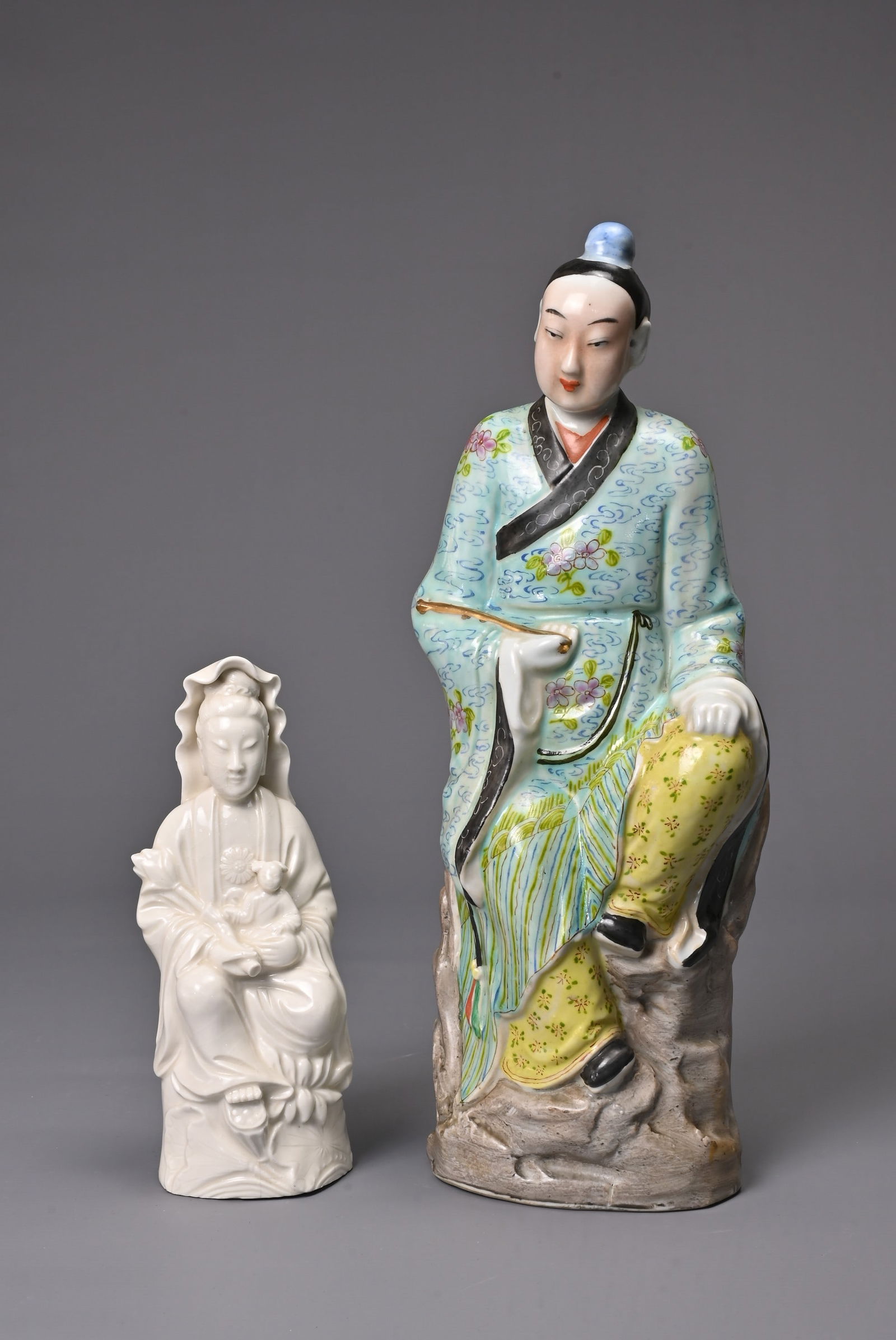 TWO CHINESE PORCELAIN FIGURES, 20TH CENTURY. To include a polychrome decorated figure of a man (1 of 6)