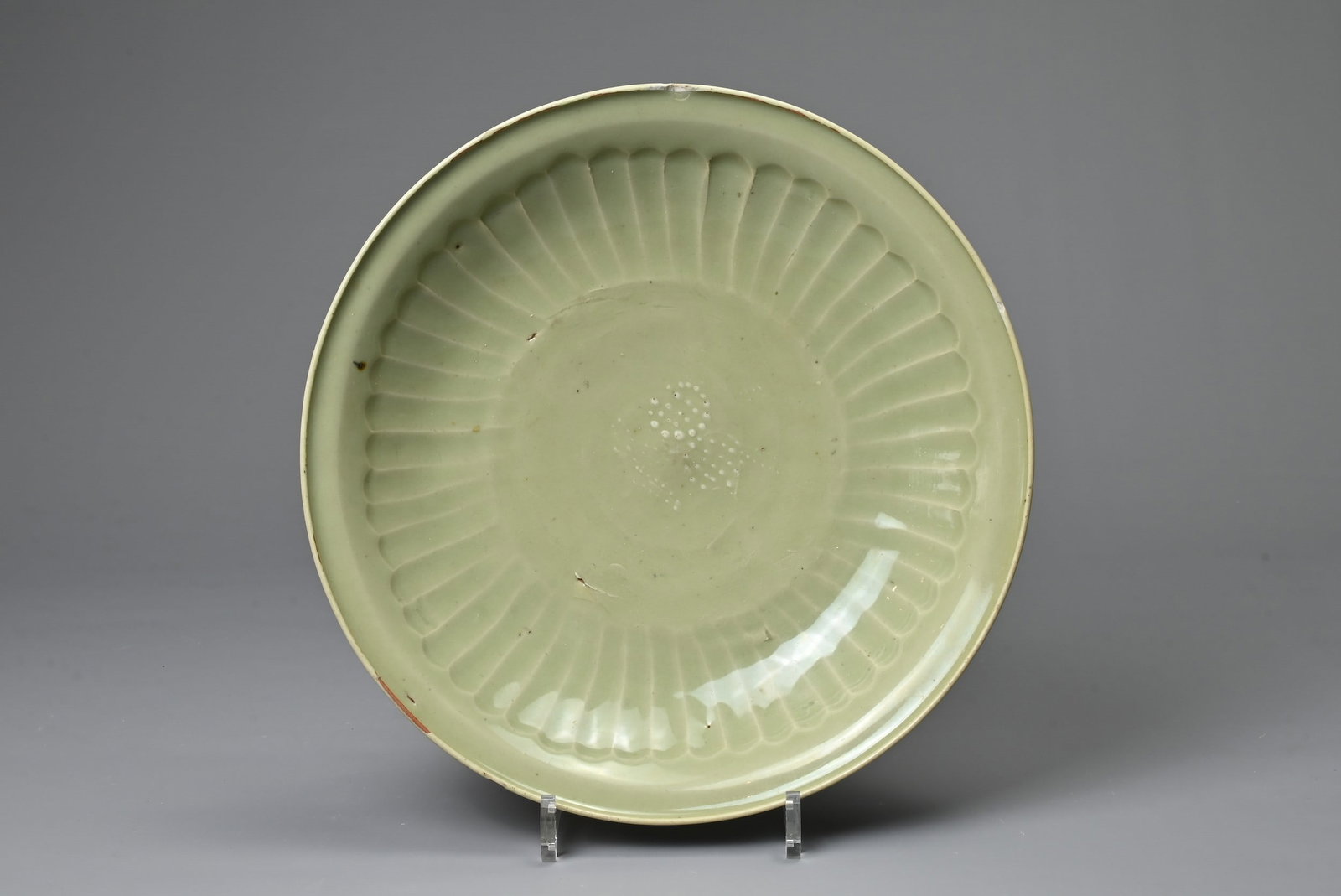 A CHINESE LONGQUAN CELADON SHALLOW DISH. Fairly finely potted with moulded ribbed interior in the (1 of 6)