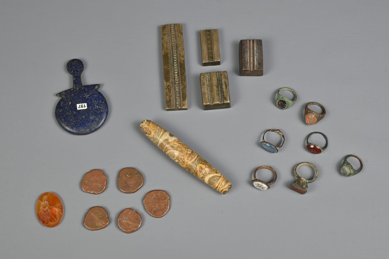 A MIXED GROUP OF STONE AND METALWARE ITEMS. To include four Indian bronze jewellery moulds or (1 of 10)